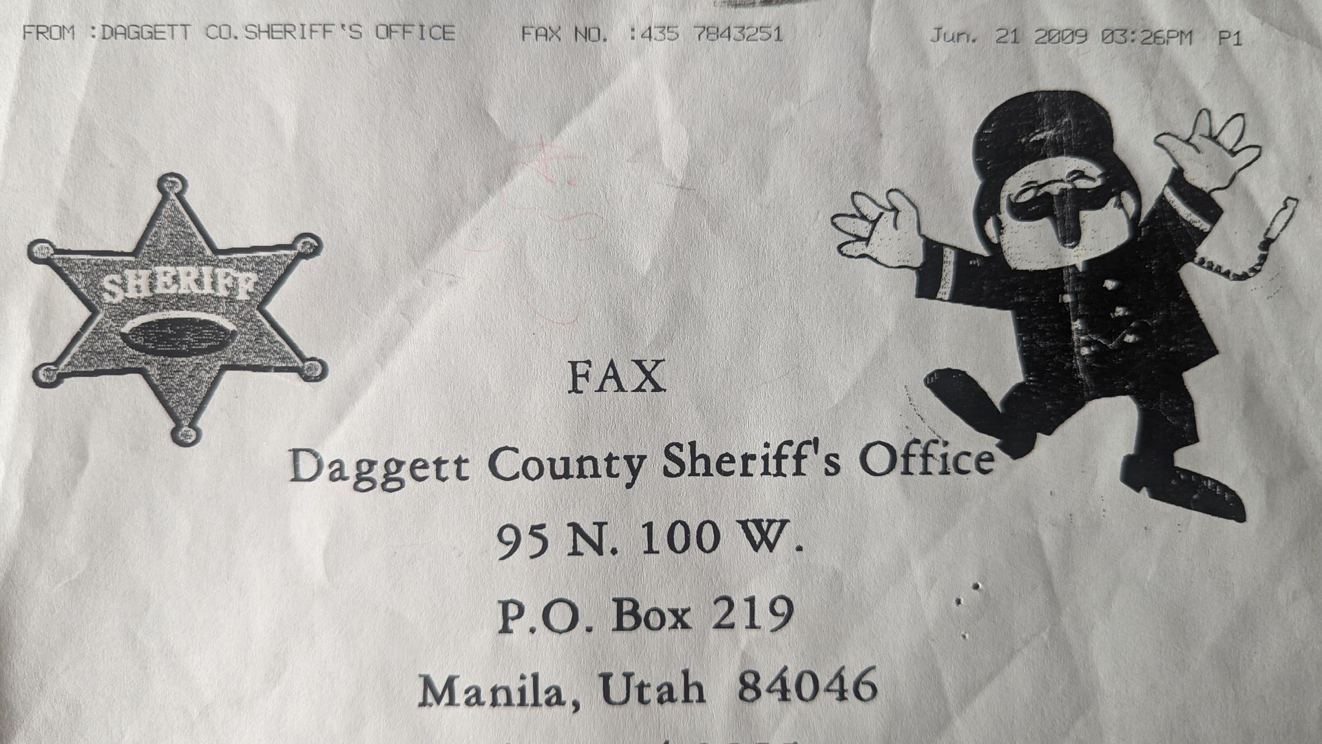 A fax cover sheet shows a letterhead for the Daggett County Sheriff's Office, with a cartoon drawing of a dancing constable.