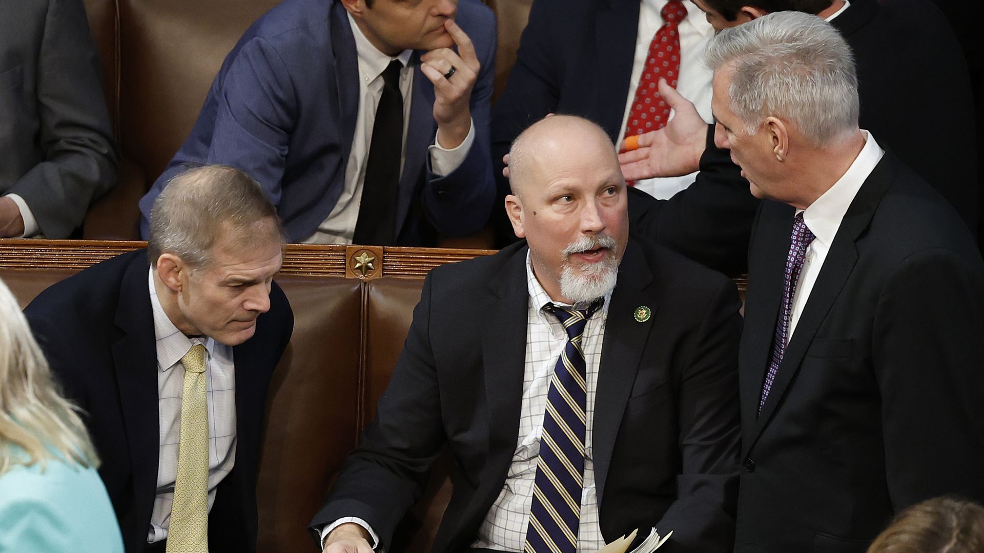 U.S. House Republican Leader Kevin McCarthy (R-CA) (R) talks to Rep.-elect Chip Roy (R-TX) (C) and Rep.-elect Jim Jordan (R-OH) in the House Chamber