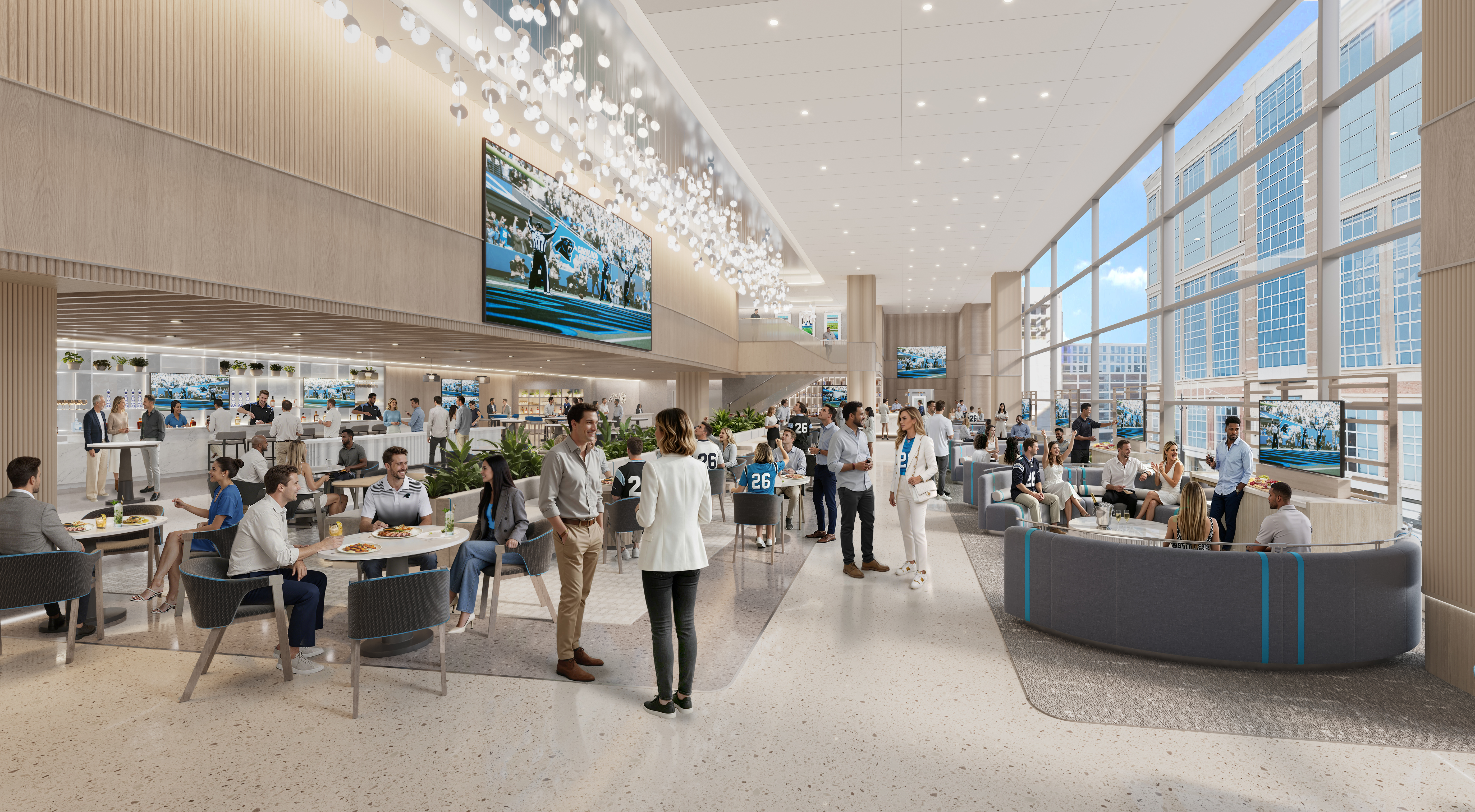 Modern open atrium with floor-to-ceiling windows, a busy lounge of tables and a bar, hanging orb lights, multiple sports TVs, and a mezzanine overlooking the crowd.