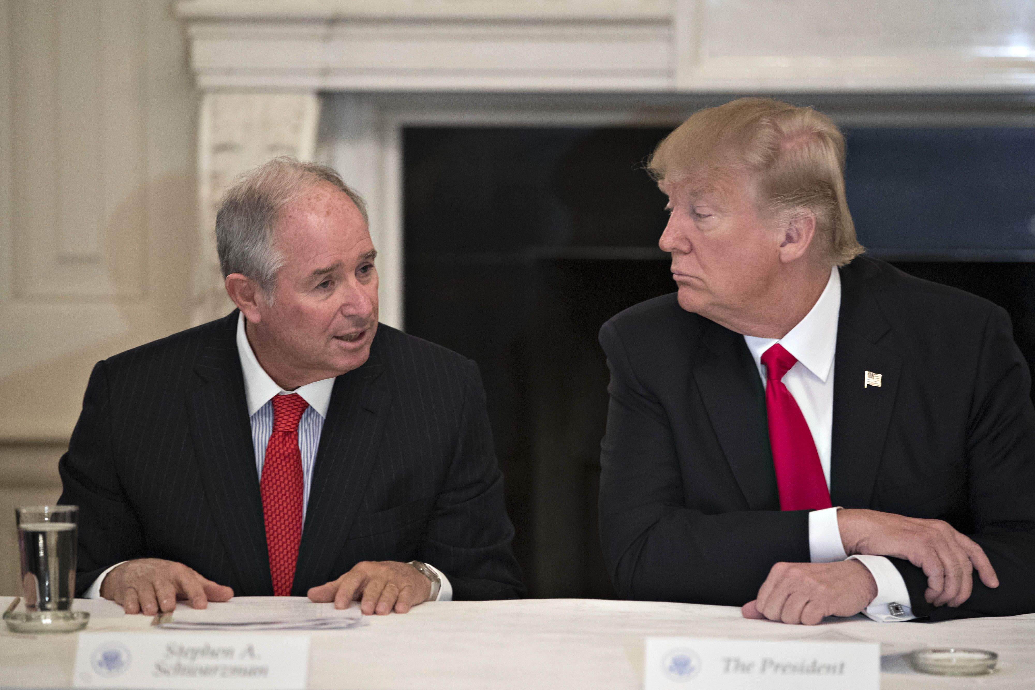 Stephen A. Schwarzman speaks next to former President Trump during a 2017 meeting at the White House.