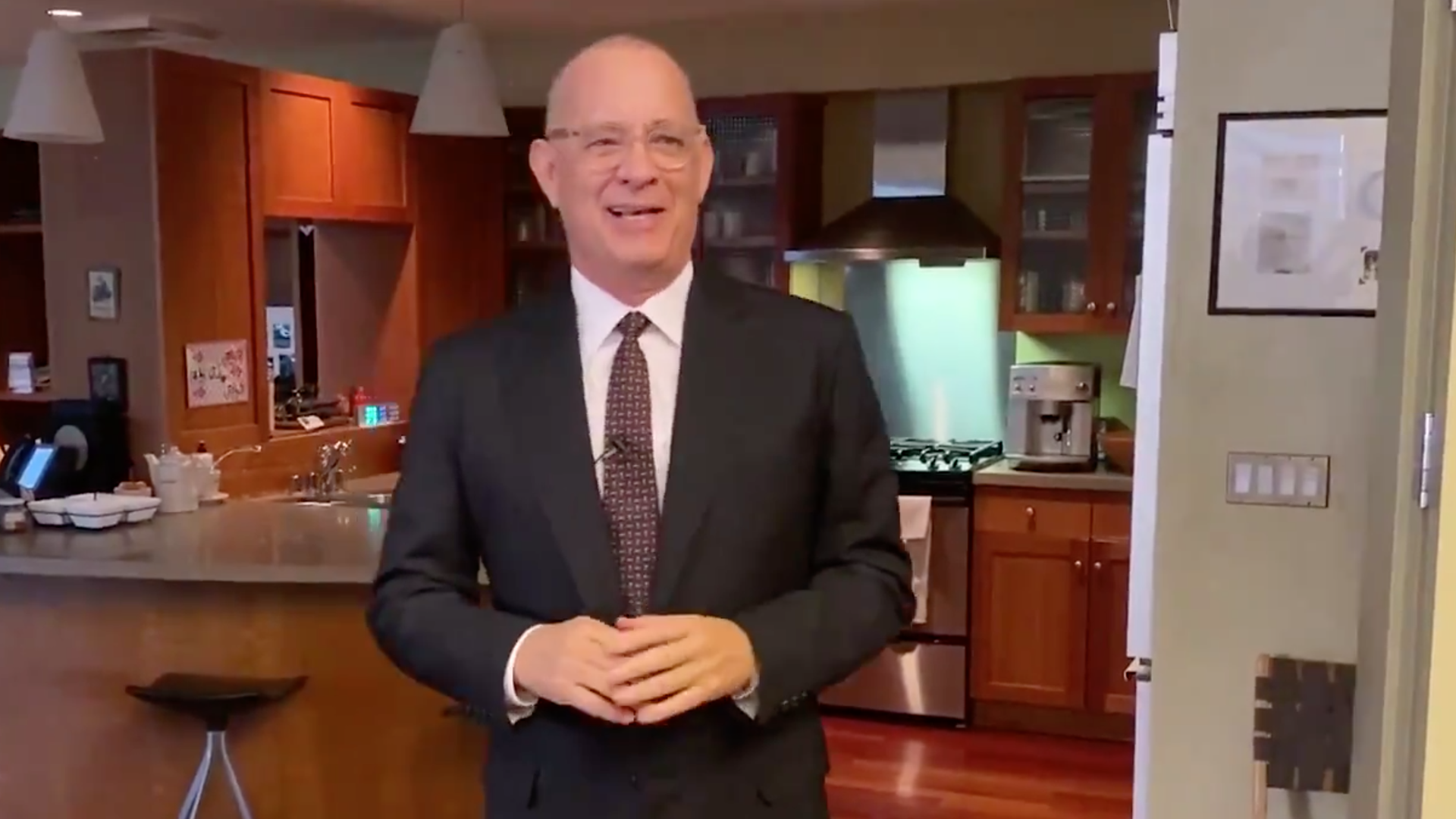 A screenshot of Tom Hanks hosting "Saturday Night Live At Home."
