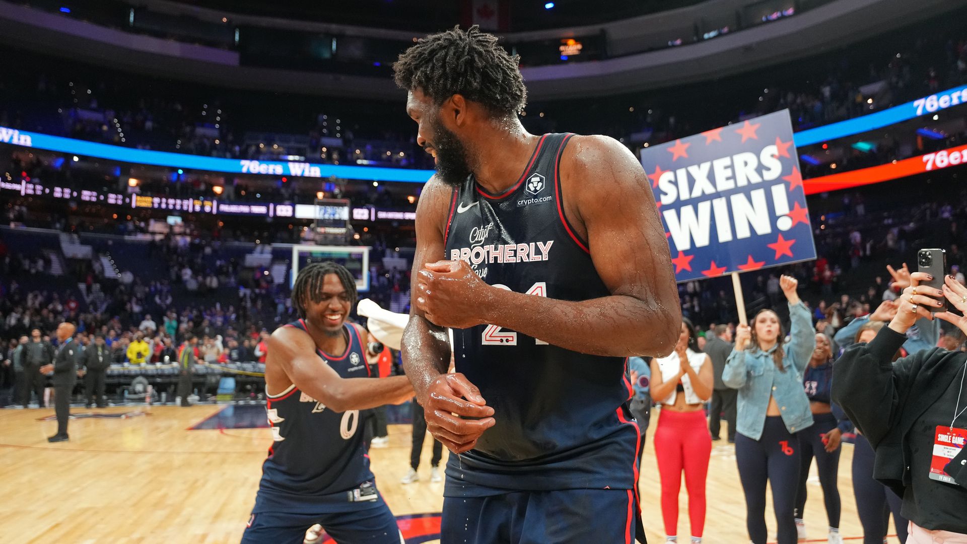 Sixers Tyrese Maxey, left, and center Joel Embiid.