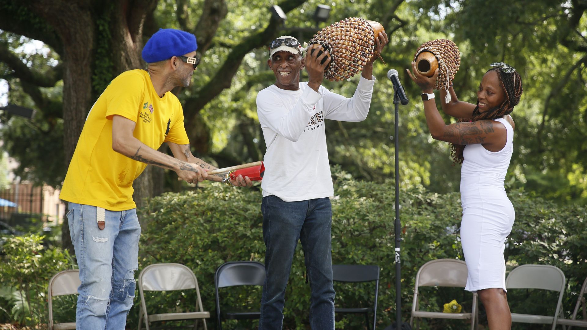 Photos shows three musicians performing at Congo Square during a Juneteenth Celebration in 2021.