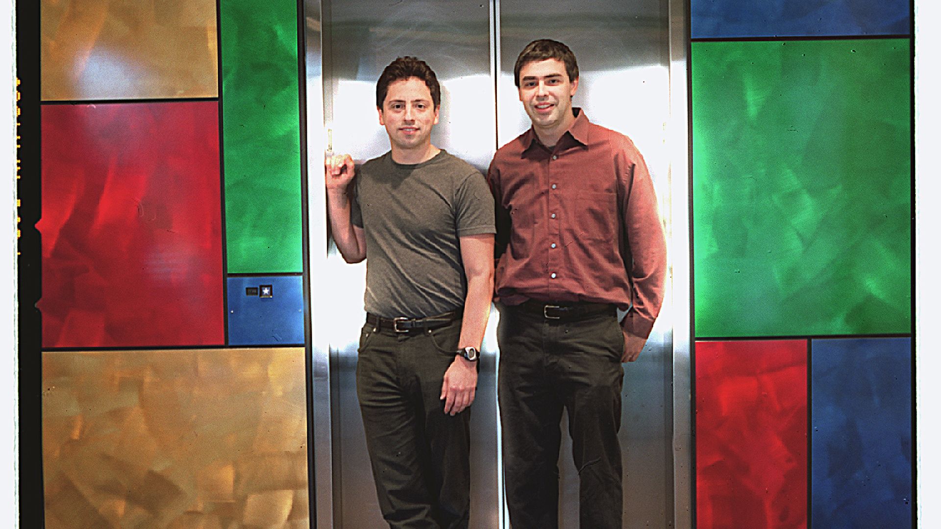 Photo of Google founders Sergey Brin and Larry Page in 2002 leaving an elevator at Google's office