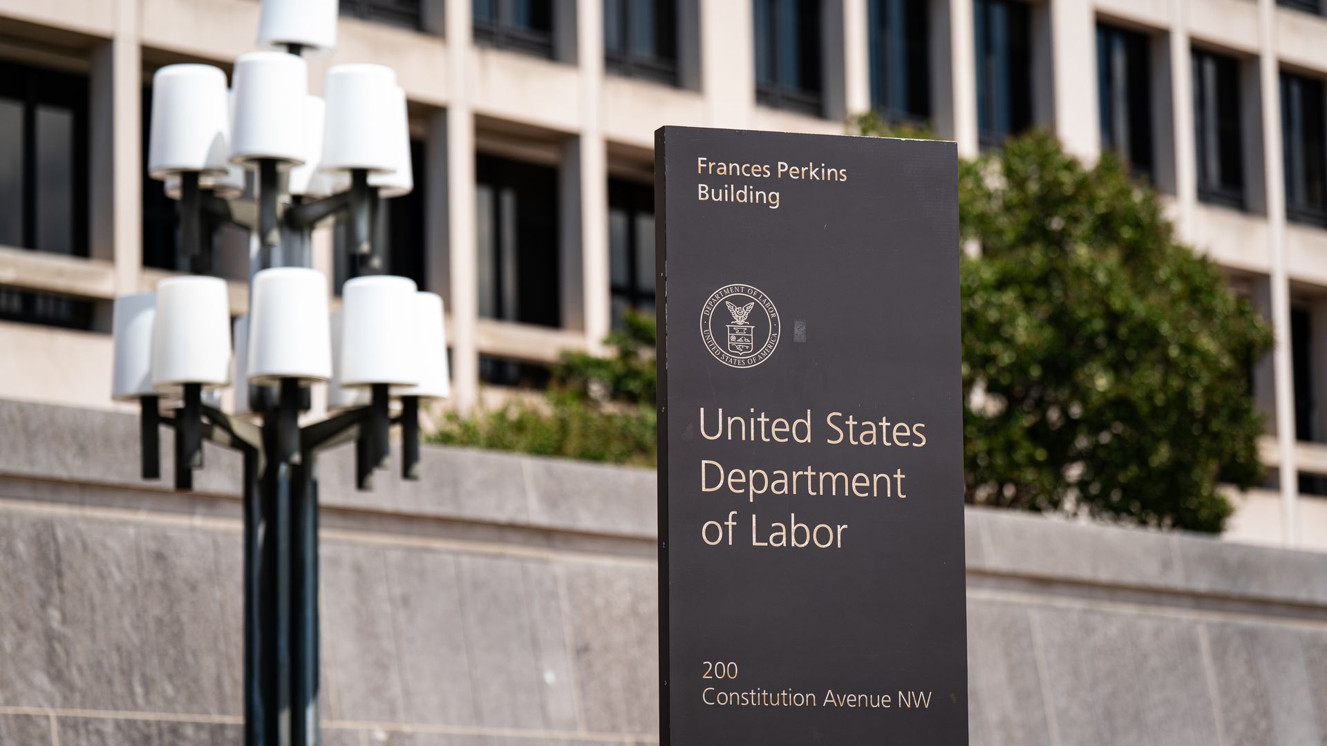 A sign marking the front of the Labor Department's headquarters.