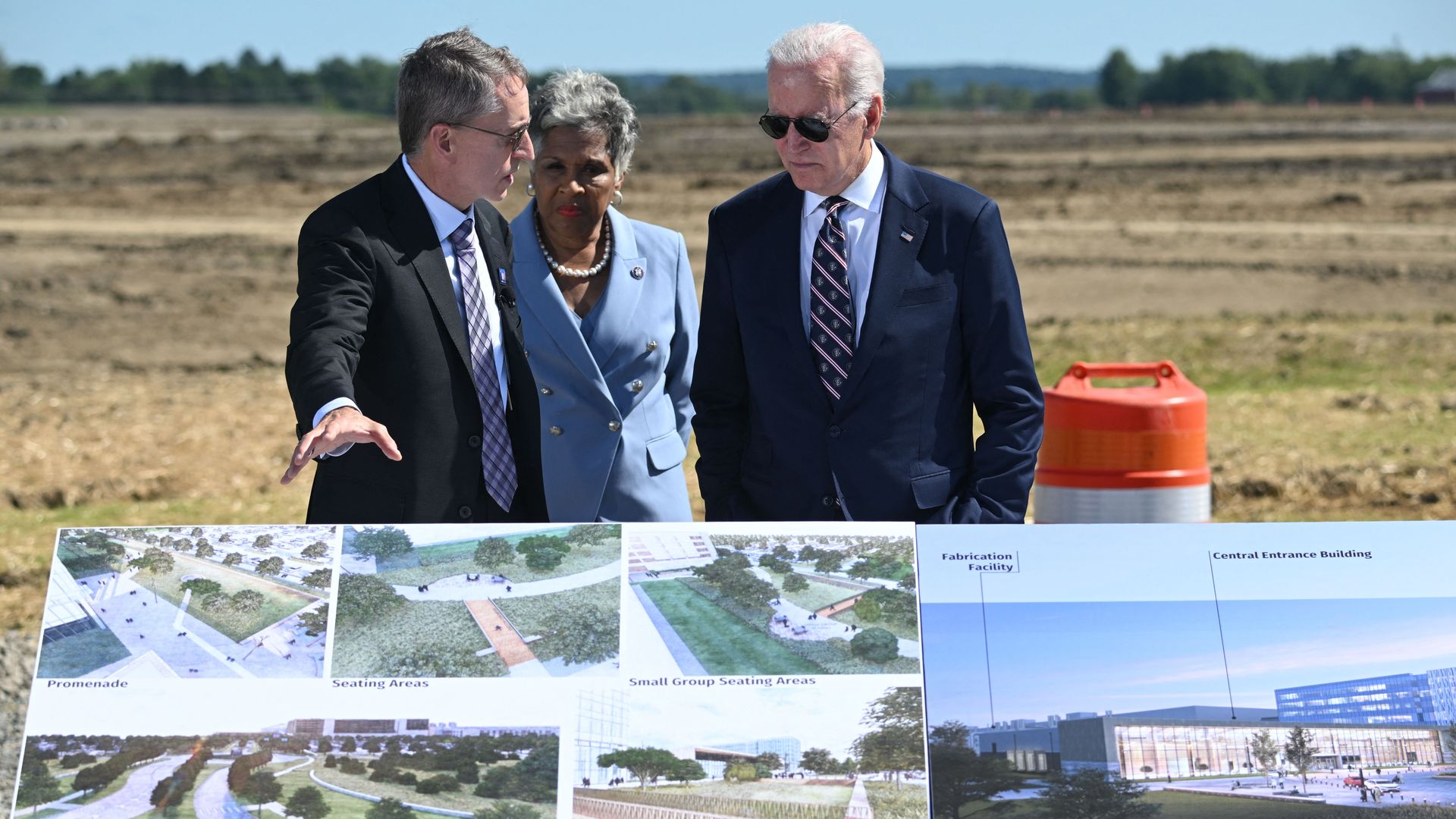 Intel CEO Pat Gelsinger shows plans for a new plant next to Congresswoman Joyce Beatty and President Joe Biden. 