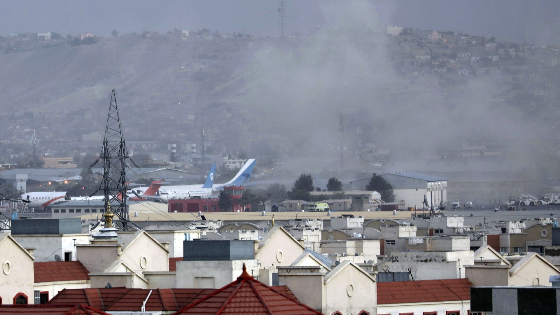 Smoke rises from the attack outside Kabul airport. Photo: Wali Sabawoon/AP