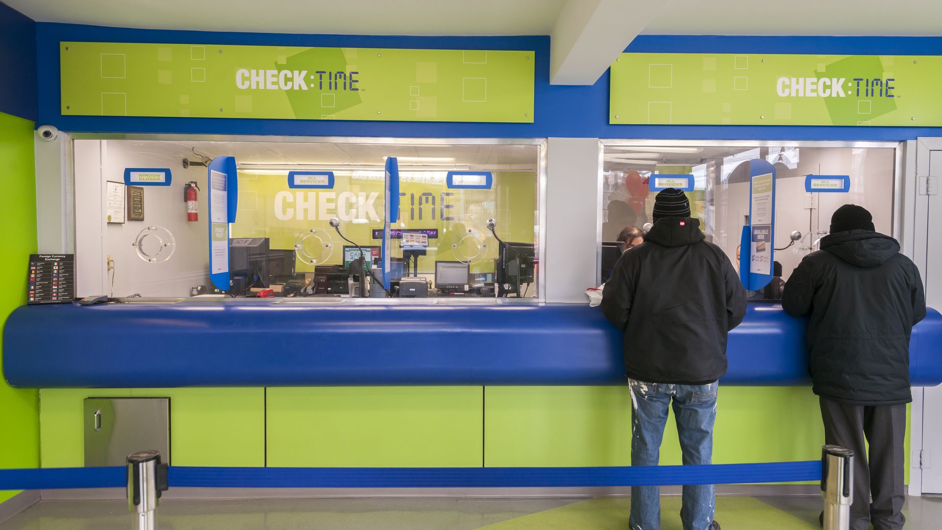 Customers in the newly remodeled branch of Check:Time in the Williamsburg neighborhood of Brooklyn in New York on Thursday, January 14, 2016. 
