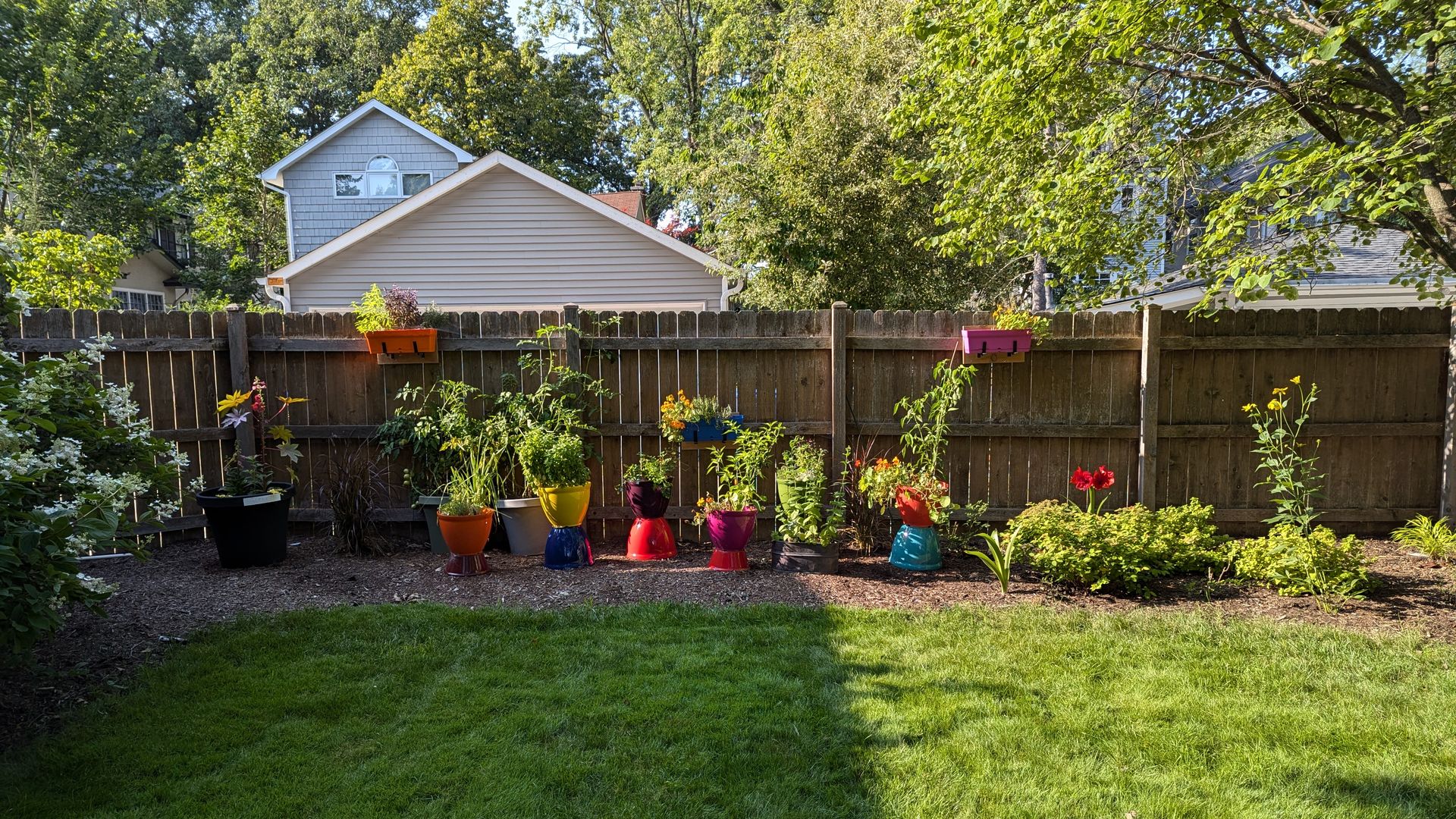a front lot garden in colorful pots