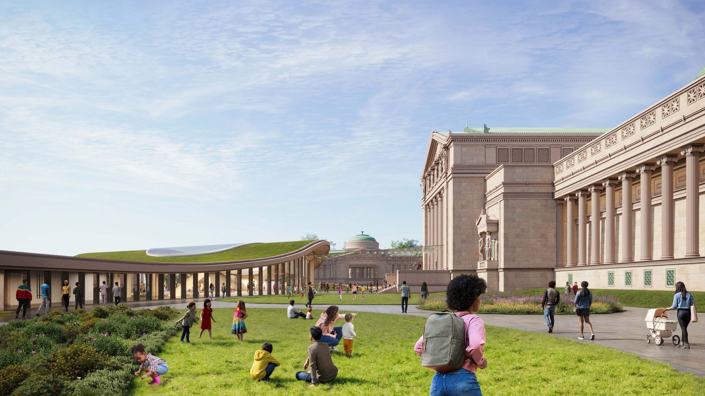 Sunny scene of a grand beige neoclassical building with tall columns on the right and a long colonnade. A green lawn plaza is filled with people walking, sitting, and kids playing.