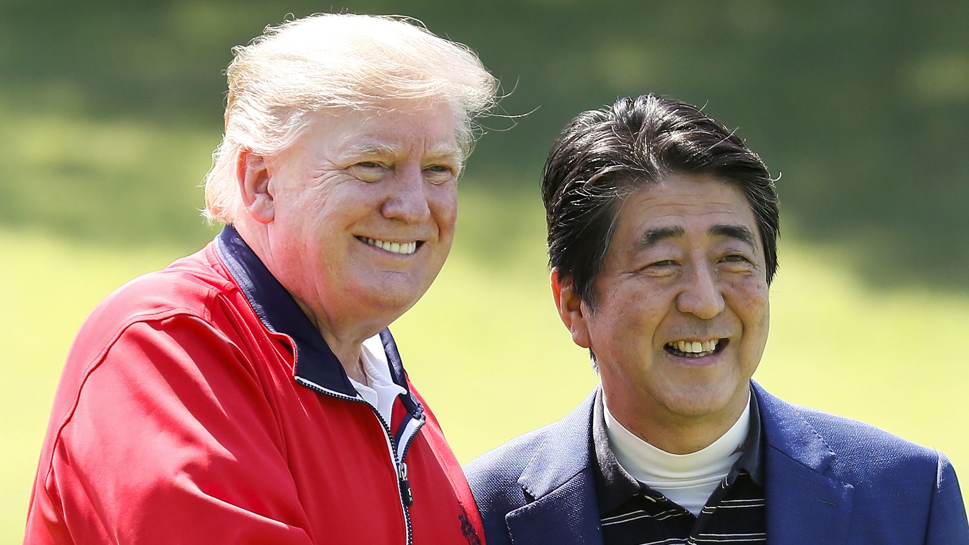  President Trump (L) is welcomed by Japanese Prime Minister Shinzo Abe as he arrives to play golf at Mobara Country Club on May 26, 2019 in Chiba, Japan.