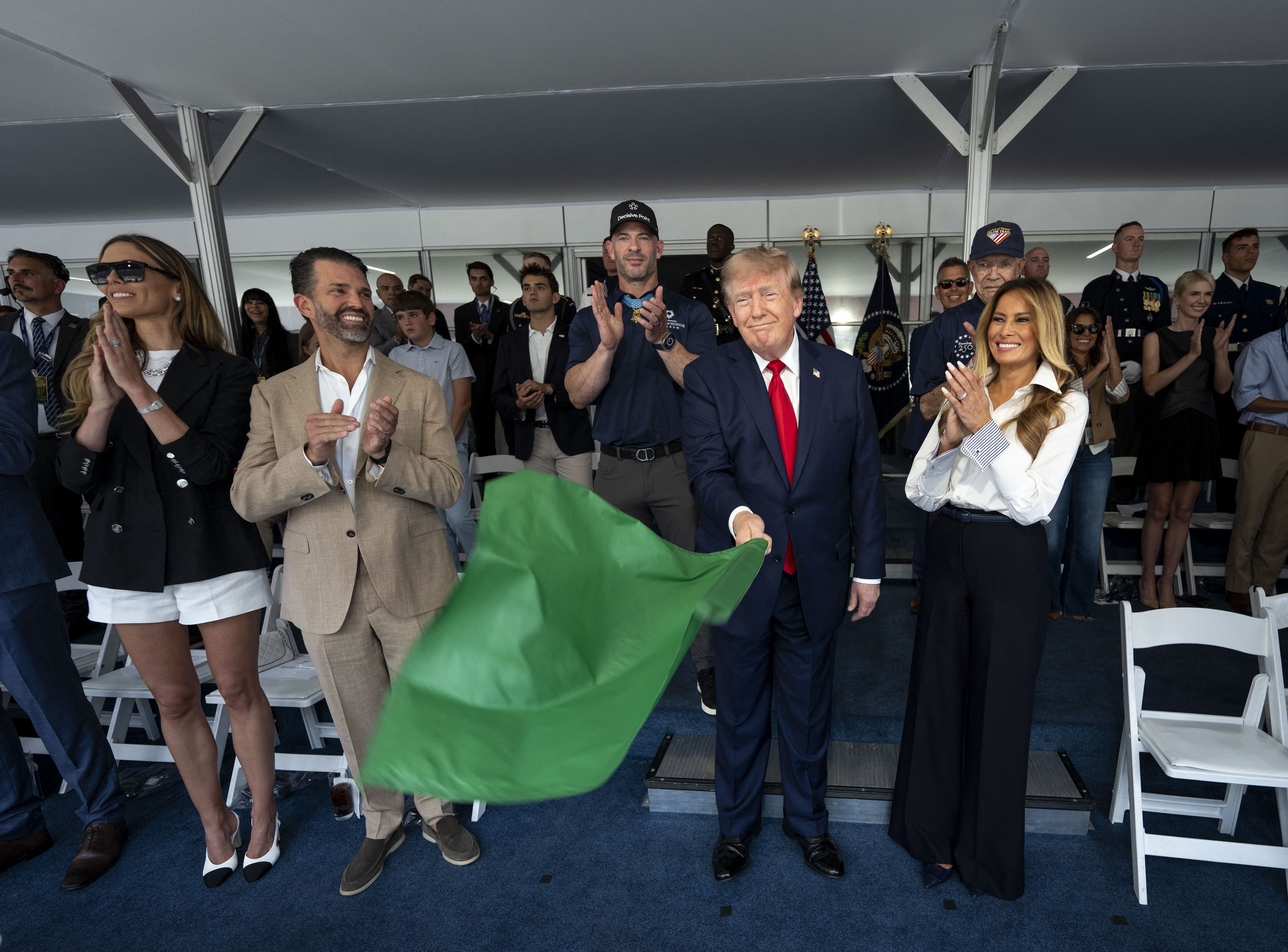 Trump waves green flag