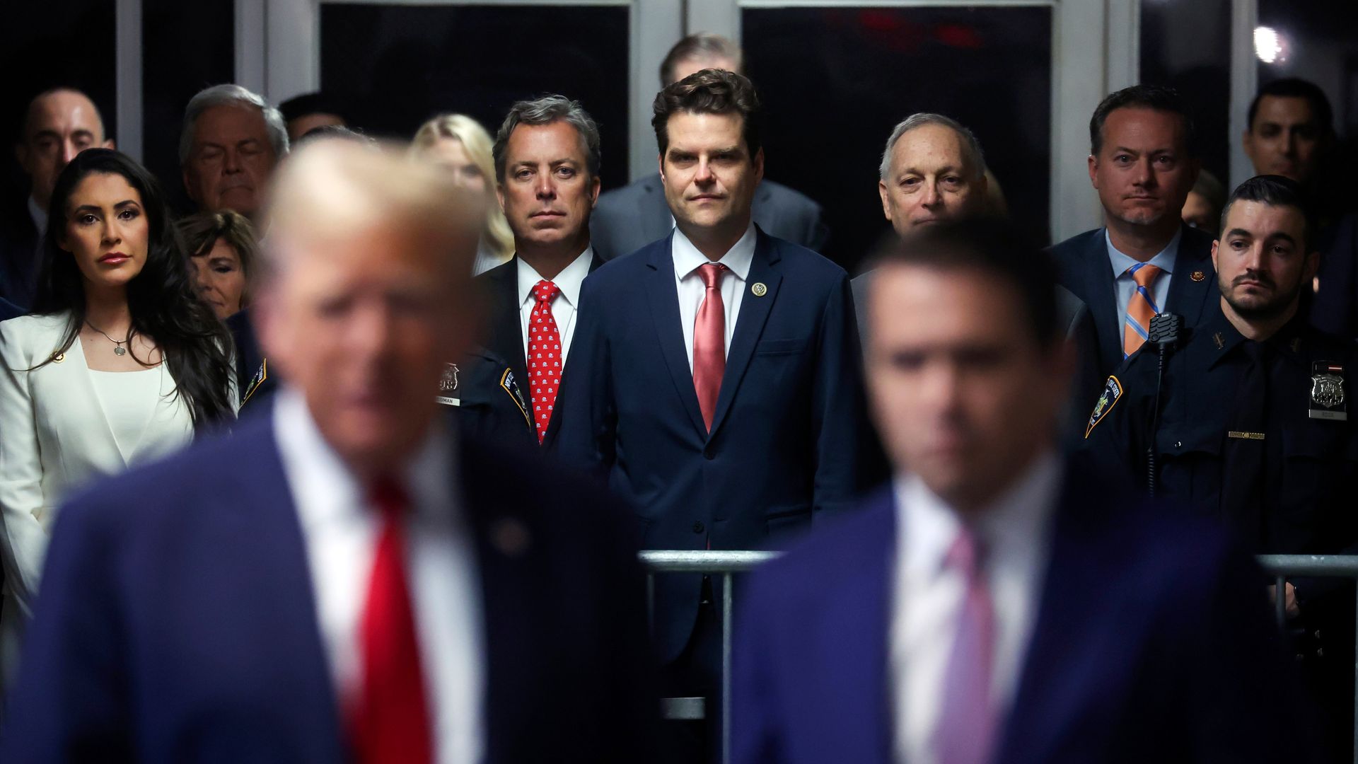 Several House Republicans, including Rep. Anna Paulina Luna, Andy Ogles, Matt Gaetz and Michael Cloud, stand behind Trump and his attorney Todd Blanche  at Manhattan criminal court.
