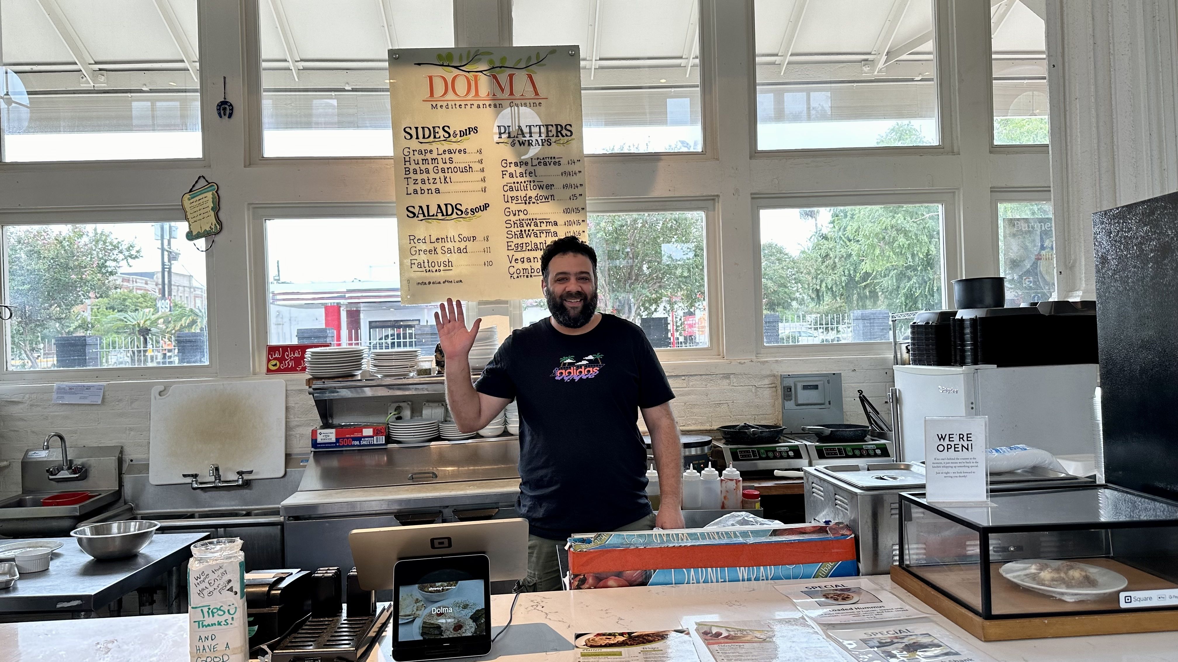 Photo shows a man waving.