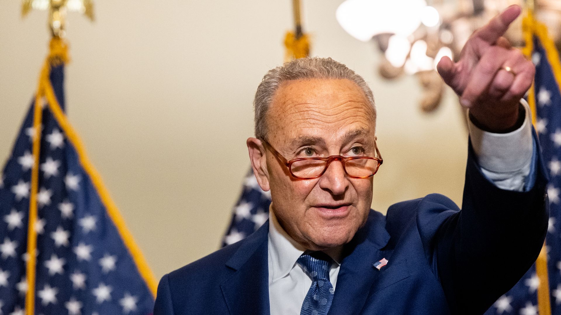 Chuck Schumer sticks his finger in the air