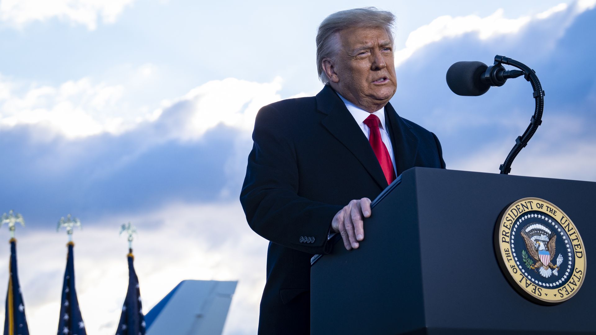 President Donald Trump speaks to supporters at Joint Base Andrews before boarding Air Force One for his last time as President on January 20, 2021 in Joint Base Andrews, Maryland.