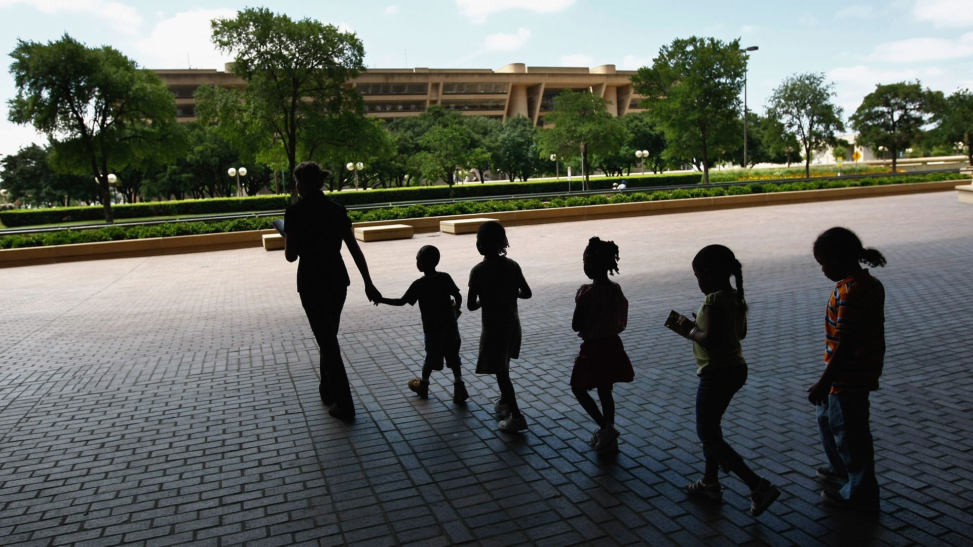 Children being led by an adult