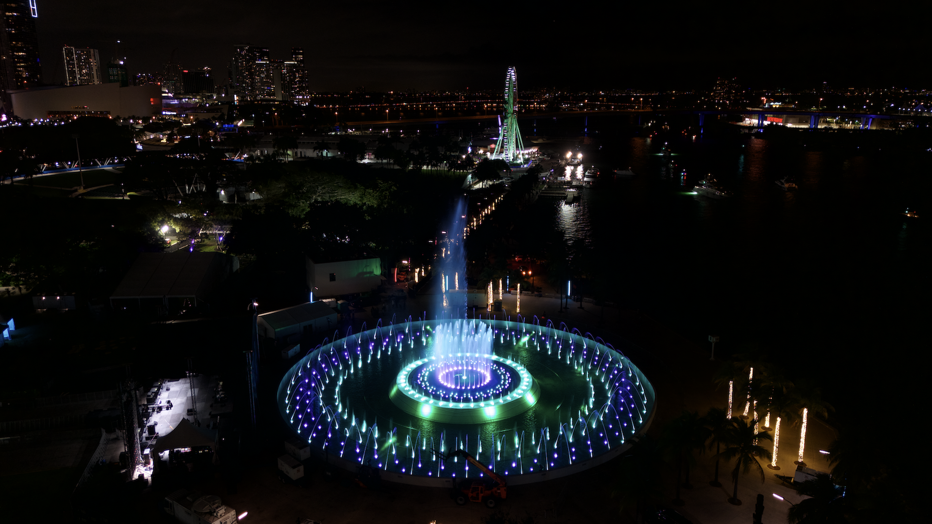 A fountain lit up with colors.