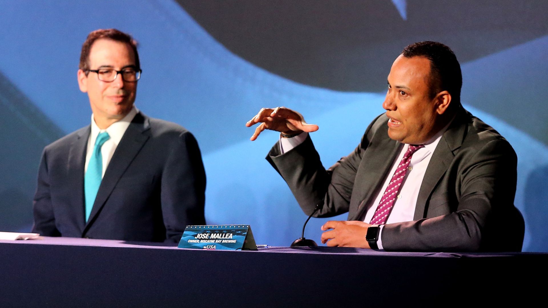 Jose Mallea speaks to U.S. President Donald Trump at a Roundtable Discussion on Tax Reform as Steven Mnuchin, U.S. Treasury Secretary, listens on Monday, April 16, 2018 at Bucky Dent Park in Hialeah, Fla.