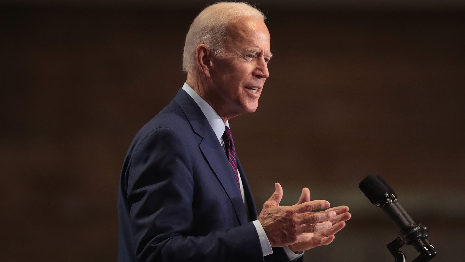 Biden talking on a stage.