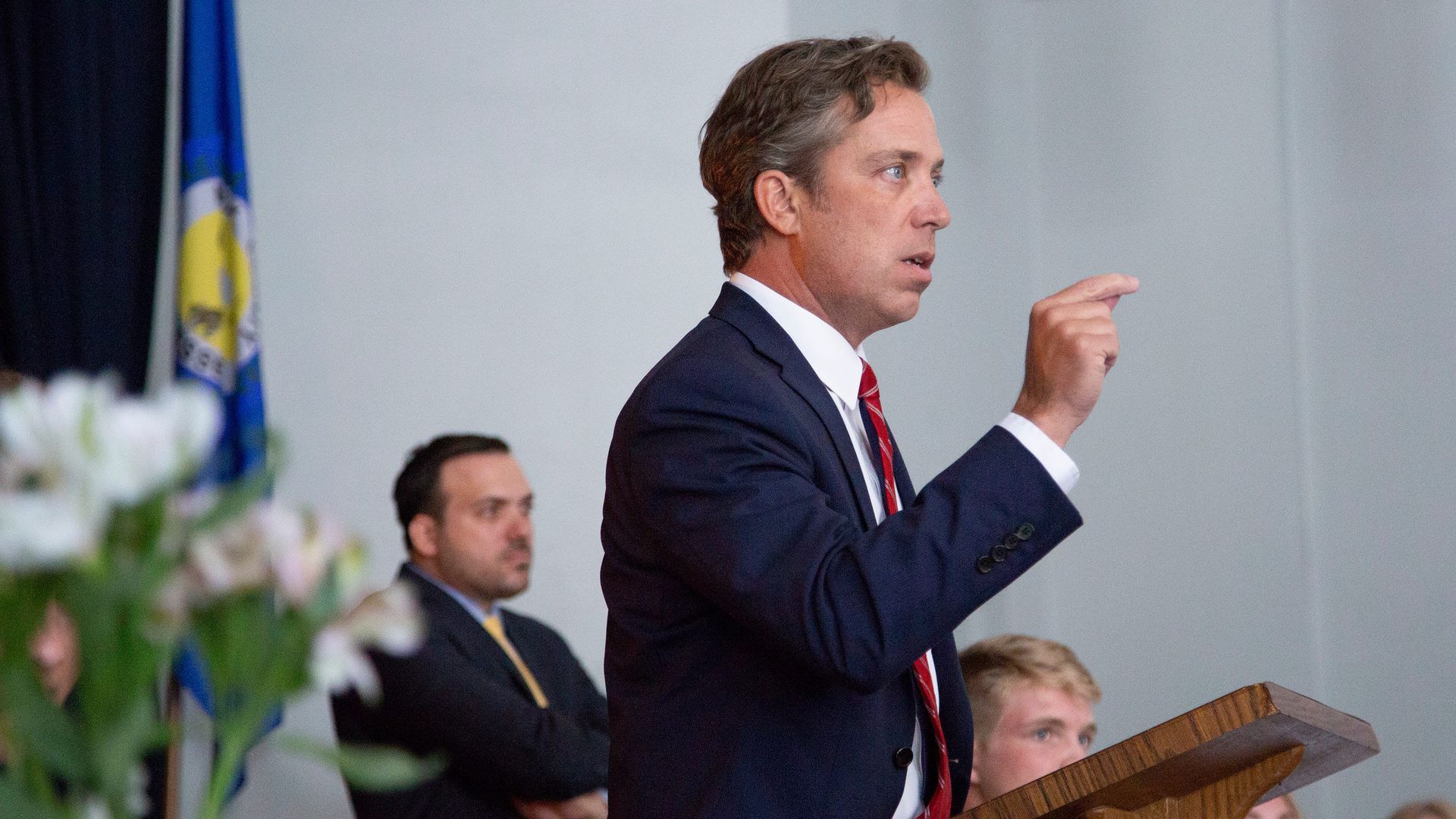 Andy Ogles talks at a podiium