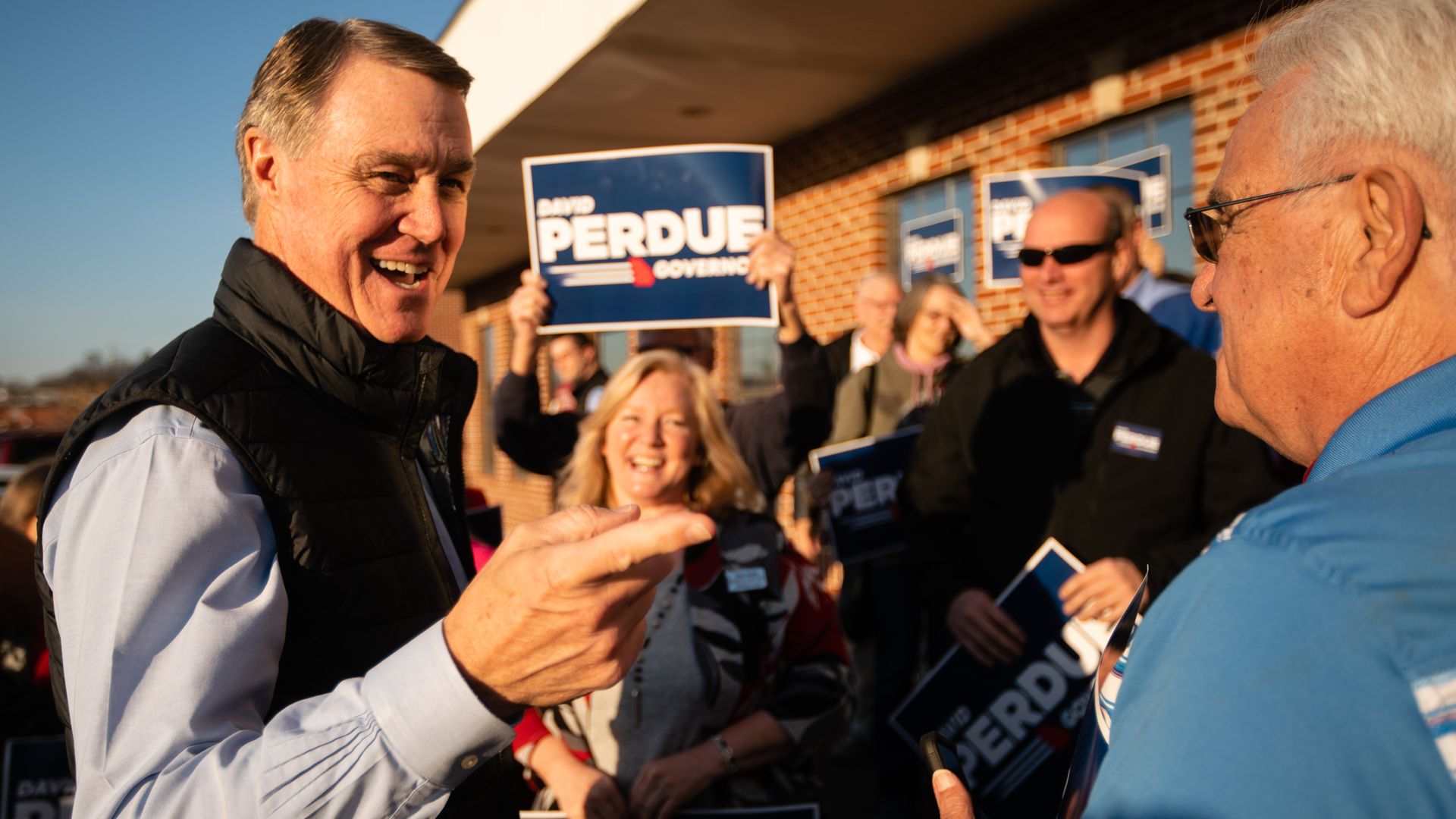 David Perdue pointing and smiling