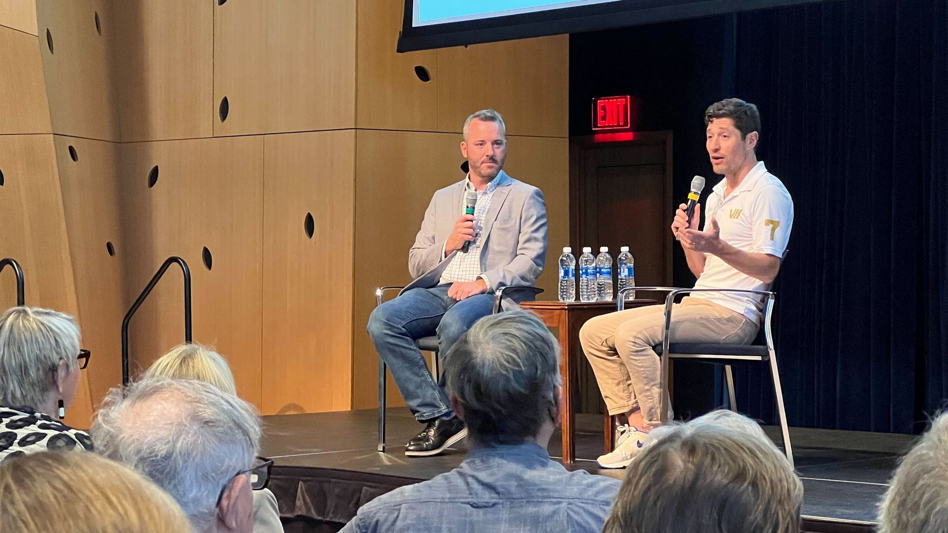 A photo of Nick Halter interviewing Jacob Frey on a stage 