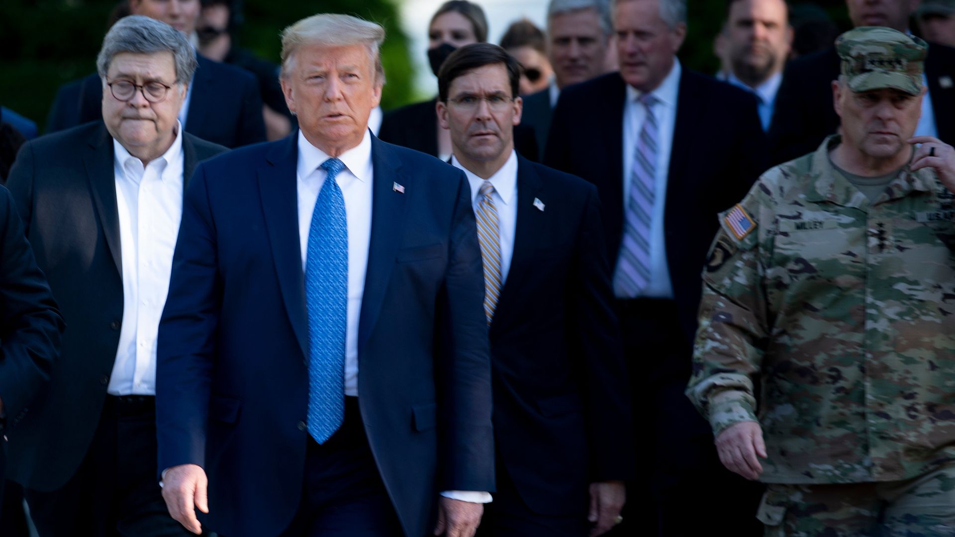 Trump with Esper following behind him to the right. Photo: Brendan Smialowski/AFP via Getty Images