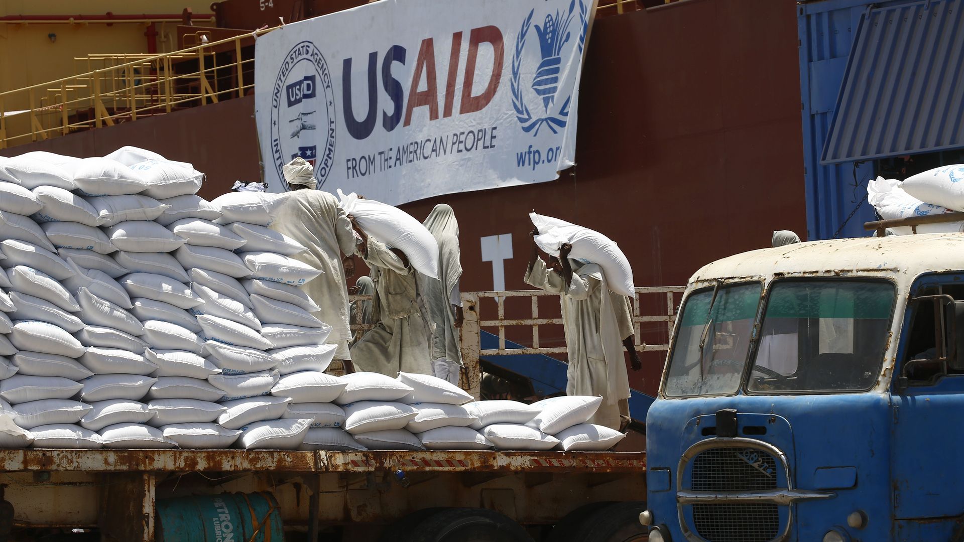 Bags of grain from USAID on a truck bed