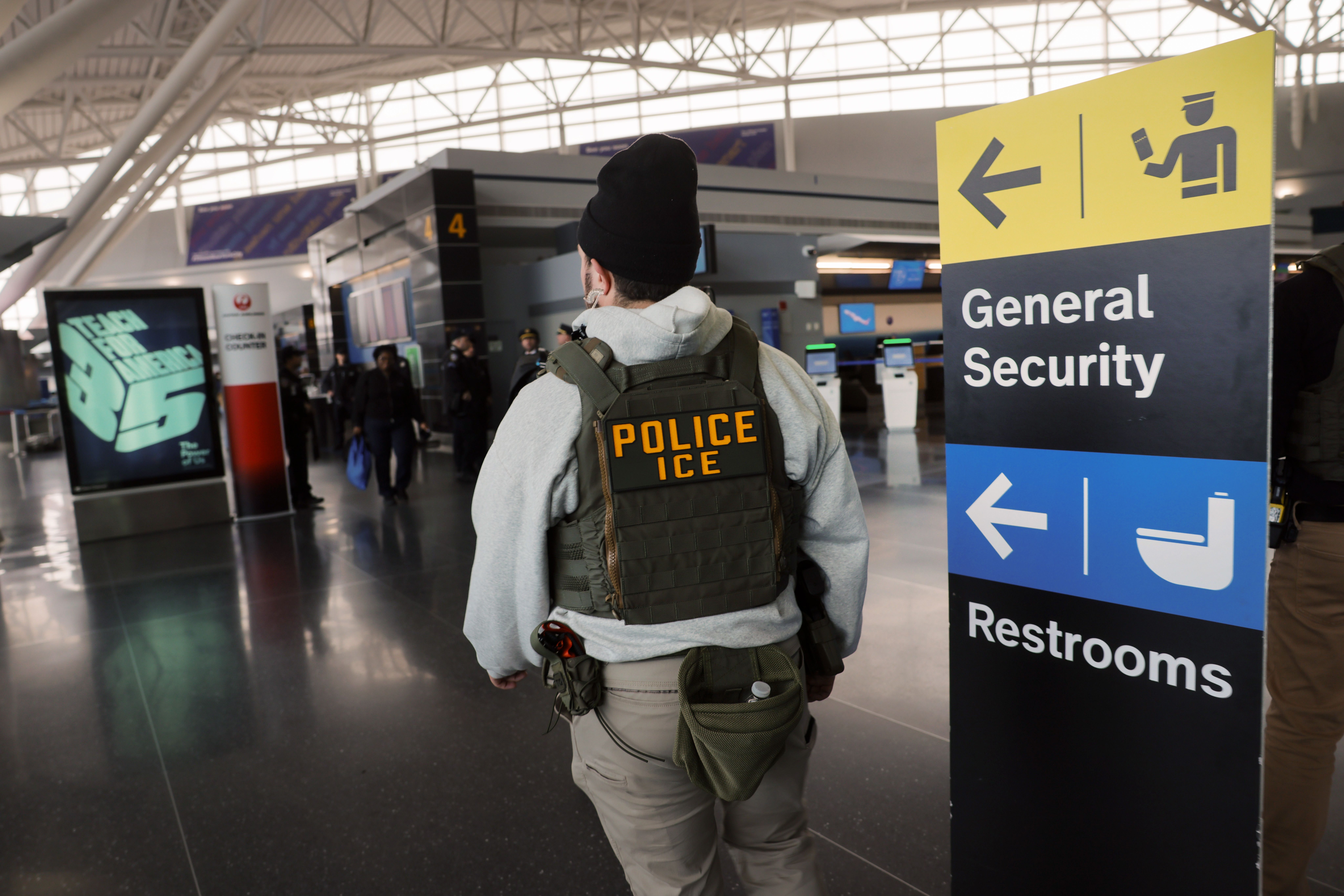 An ICE agent at John F. Kennedy International Airport yesterday. Photo: Spencer Platt/Getty Images