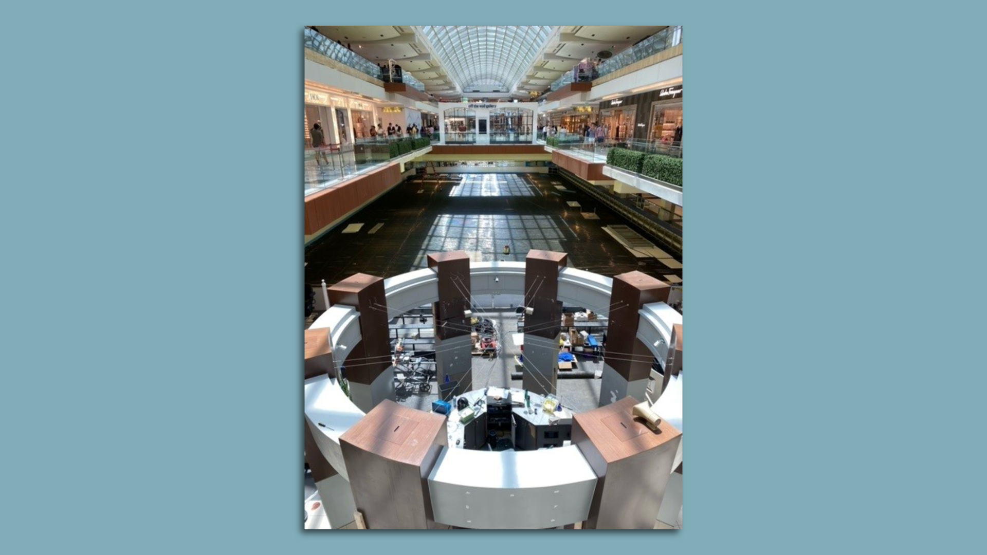 Photo of an ice rink inside a mall. 