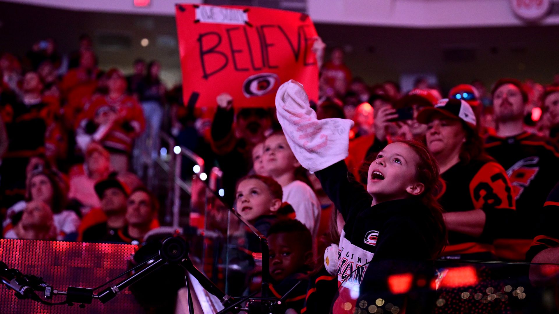 RALEIGH, NORTH CAROLINA - APRIL 20: Fans cheer during the game between the Carolina Hurricanes and the New York Islanders in Game One of the First Round of the 2024 Stanley Cup Playoffs at PNC Arena on April 20, 2024 in Raleigh, North Carolina. (Photo by Grant Halverson/Getty Images)
