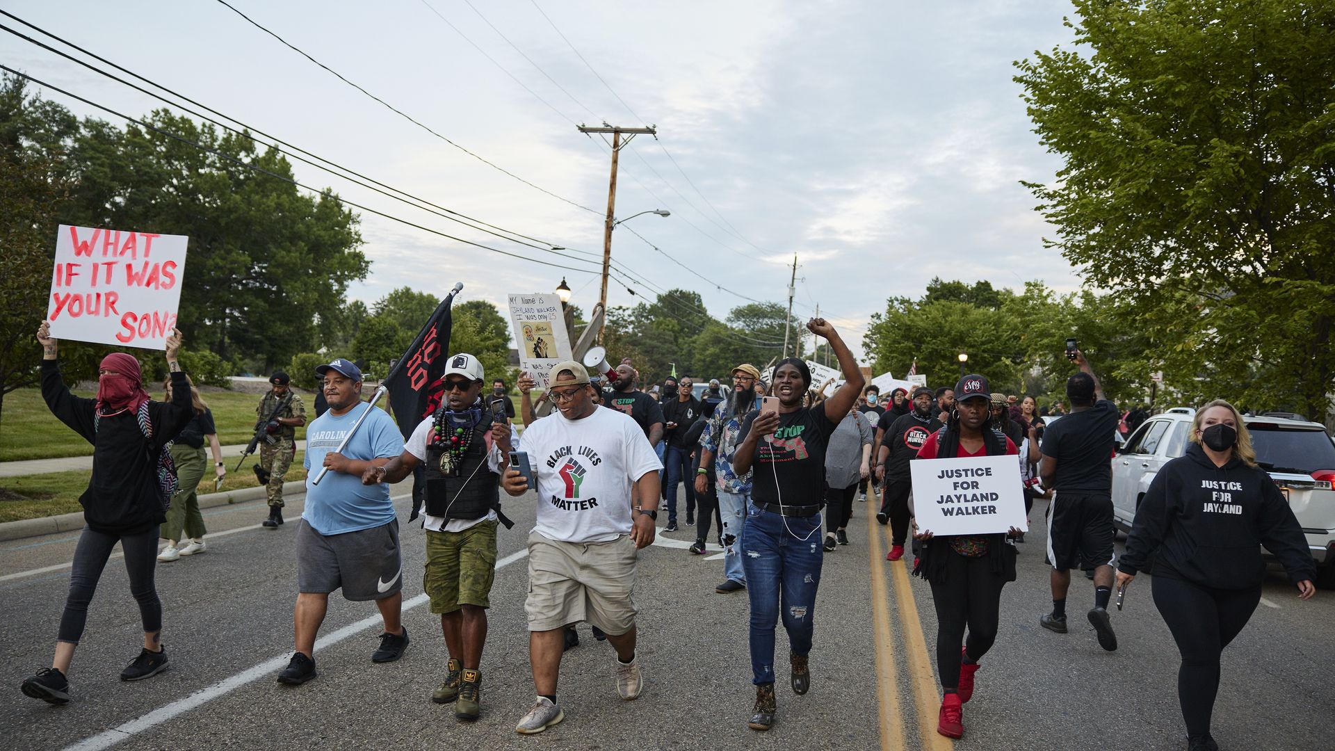 Demonstrators march down E. Wilbeth St. after holding a vigil in honor of Jayland Walker on July 8, 2022 in Akron, Ohio.