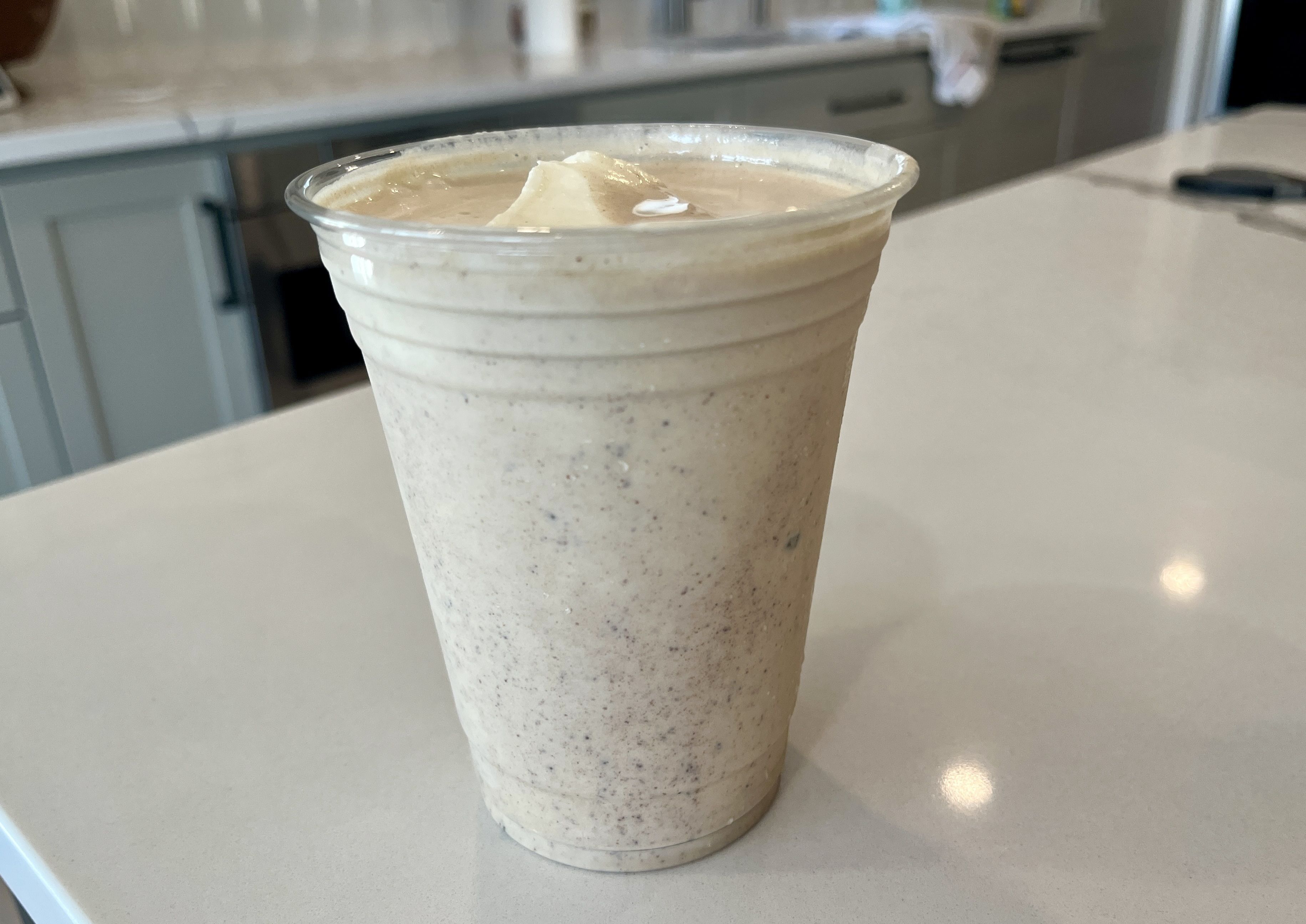 Milk shake in plastic cup.