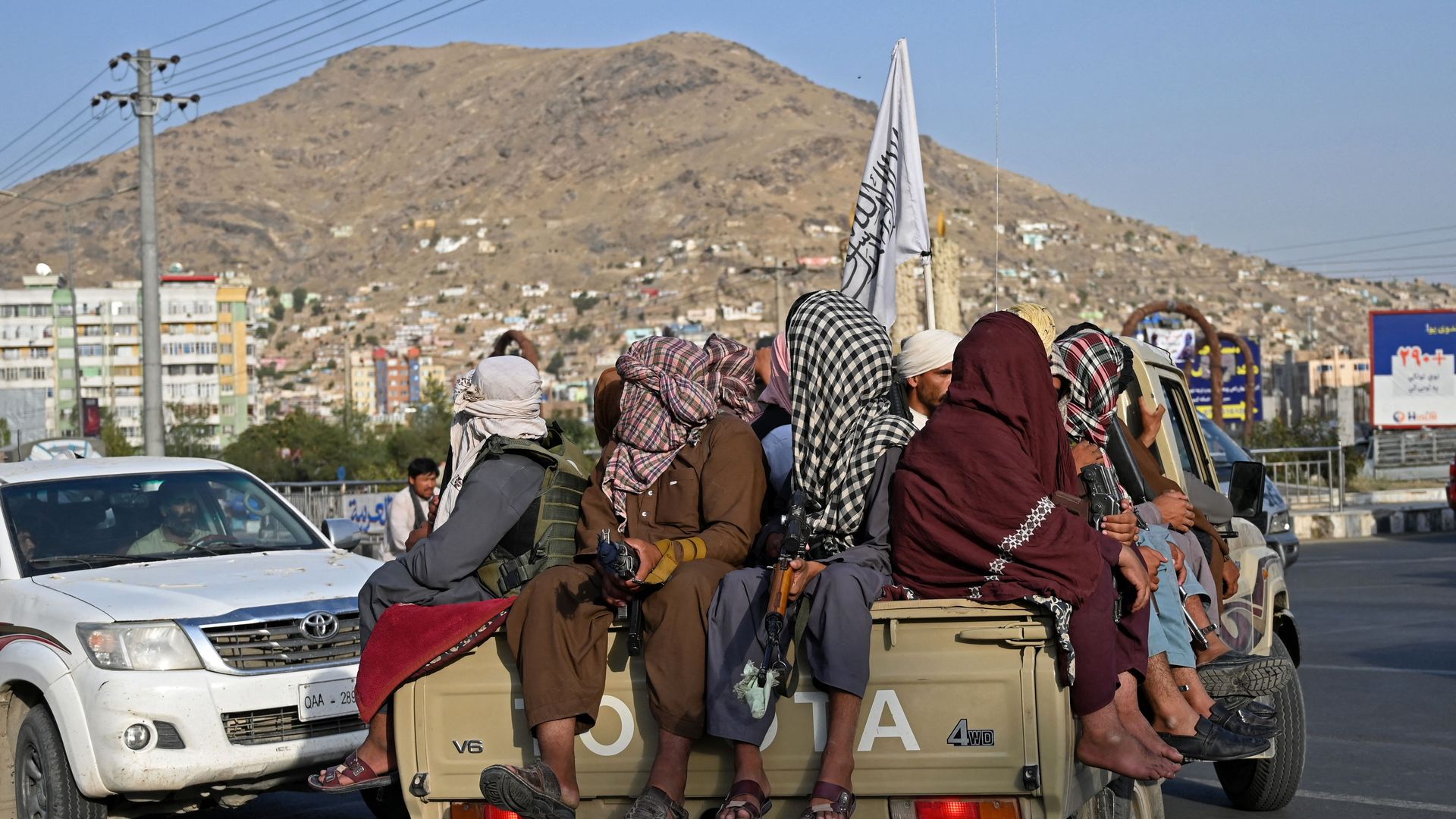 Taliban fighters in a vehicle patrol the streets of Kabul on August 23, 2021.