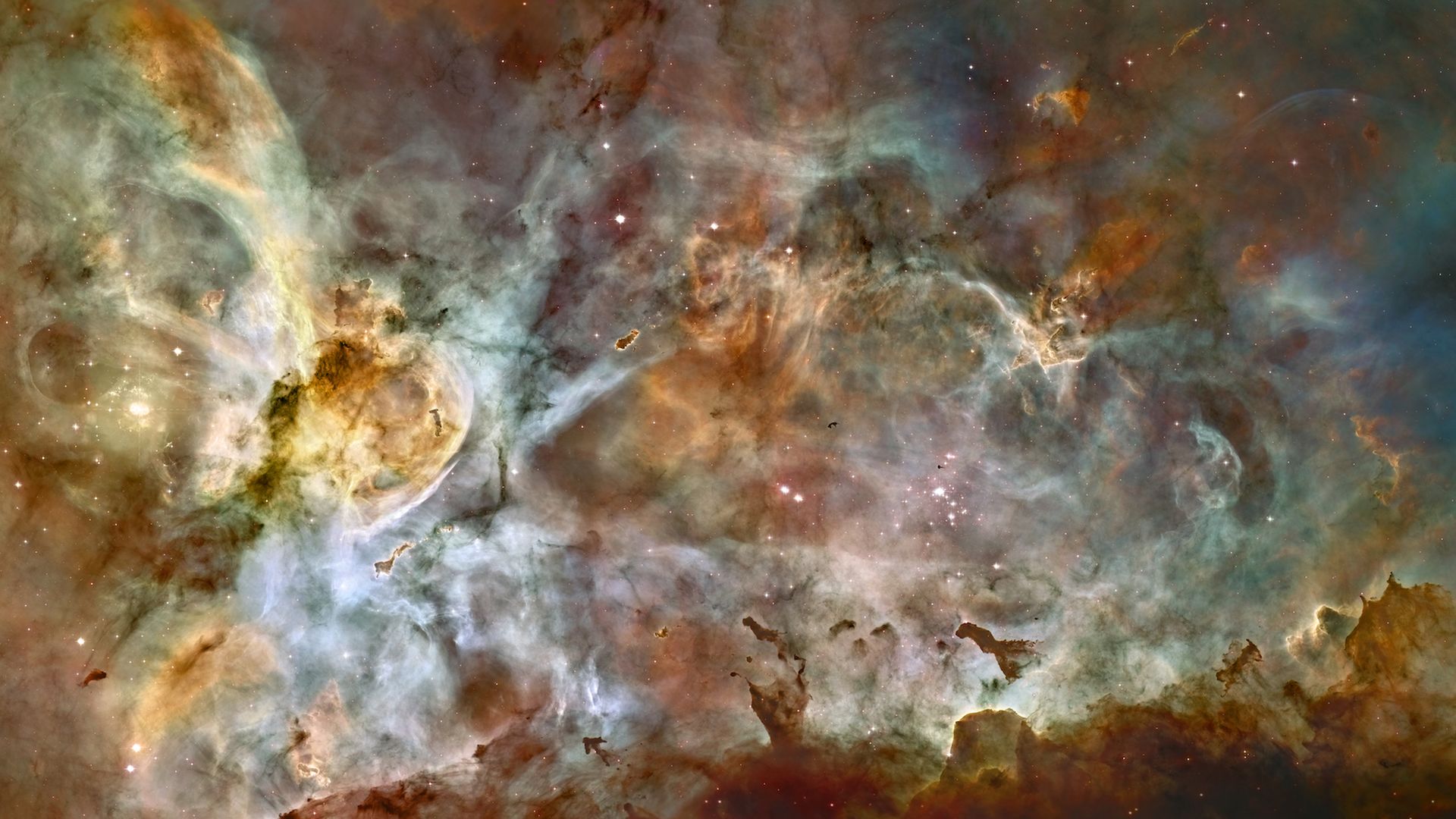 The clouds of gas and colorful dust seen by the Hubble Space Telescope in the Carina nebula.