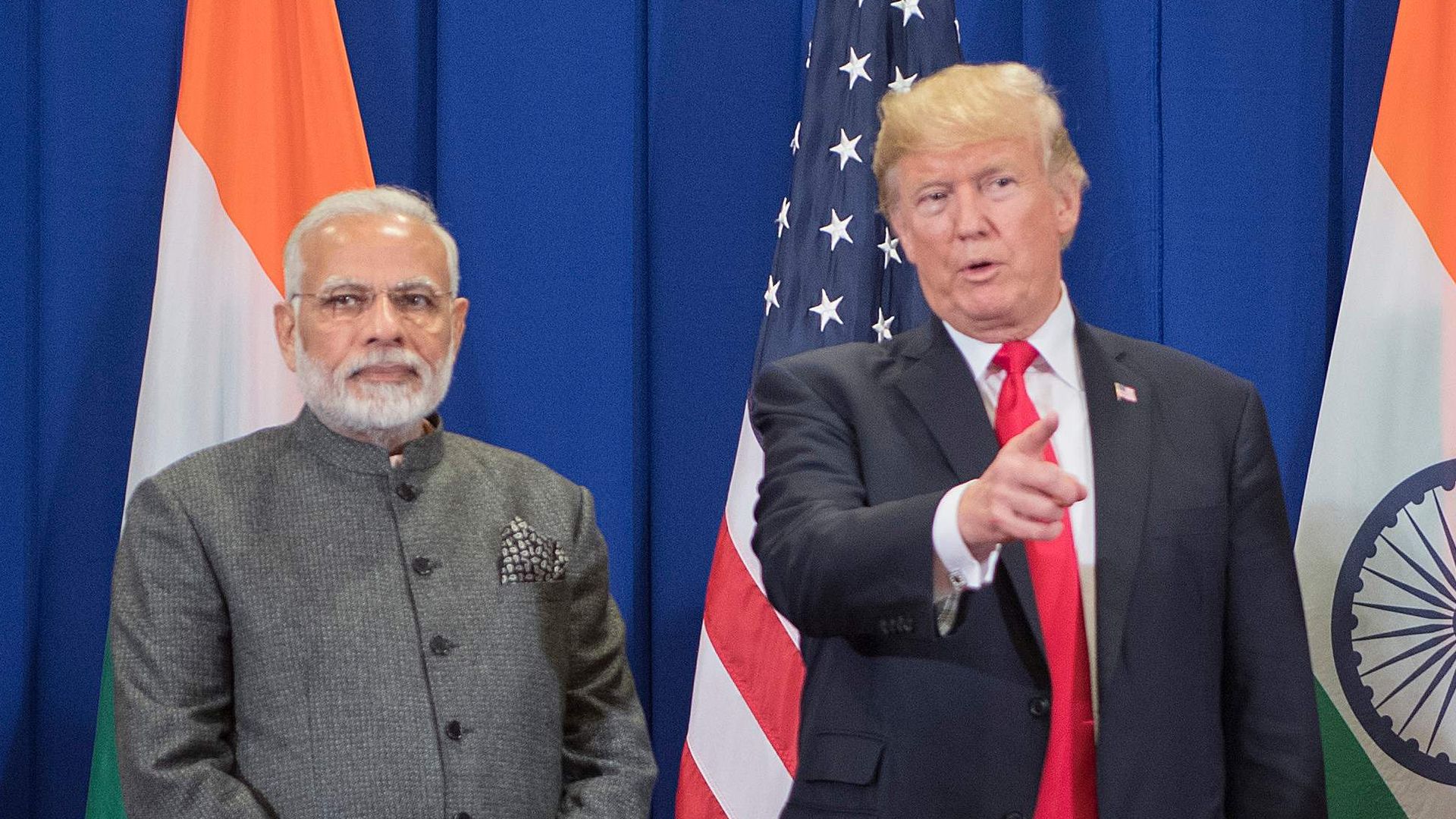  US President Donald Trump (C) speaks with Indian Prime Minister Narendra Modi on the sideline of the 31st Association of Southeast Asian Nations (ASEAN) Summit in Manila on November 13, 2017. 