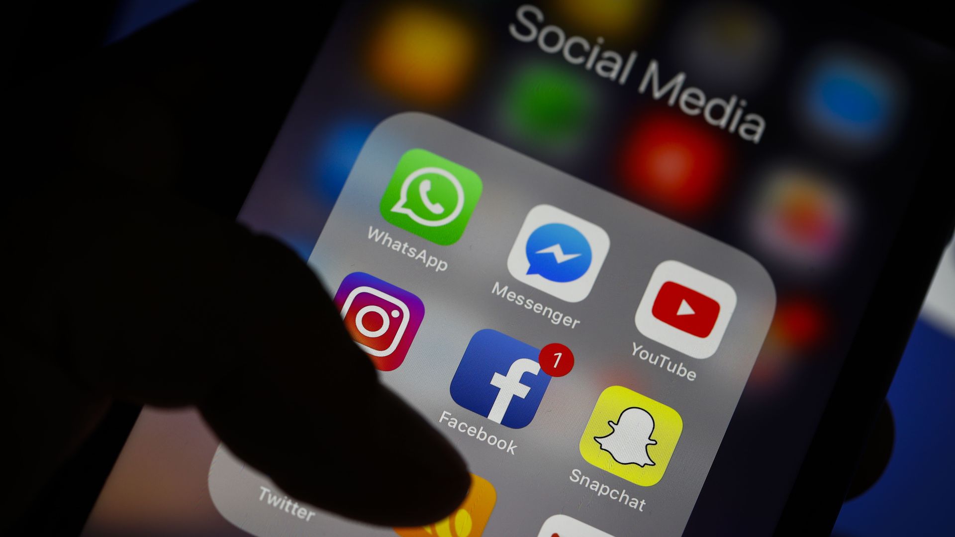 Photo of social media app icons on a smartphone screen