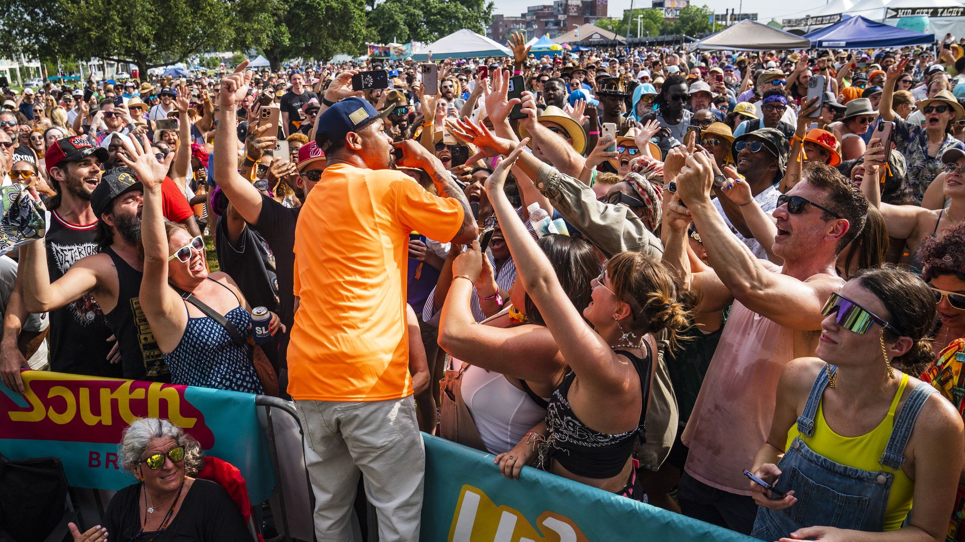 Juvenile performs at the edge of a crowded Bayou Boogaloo audience.