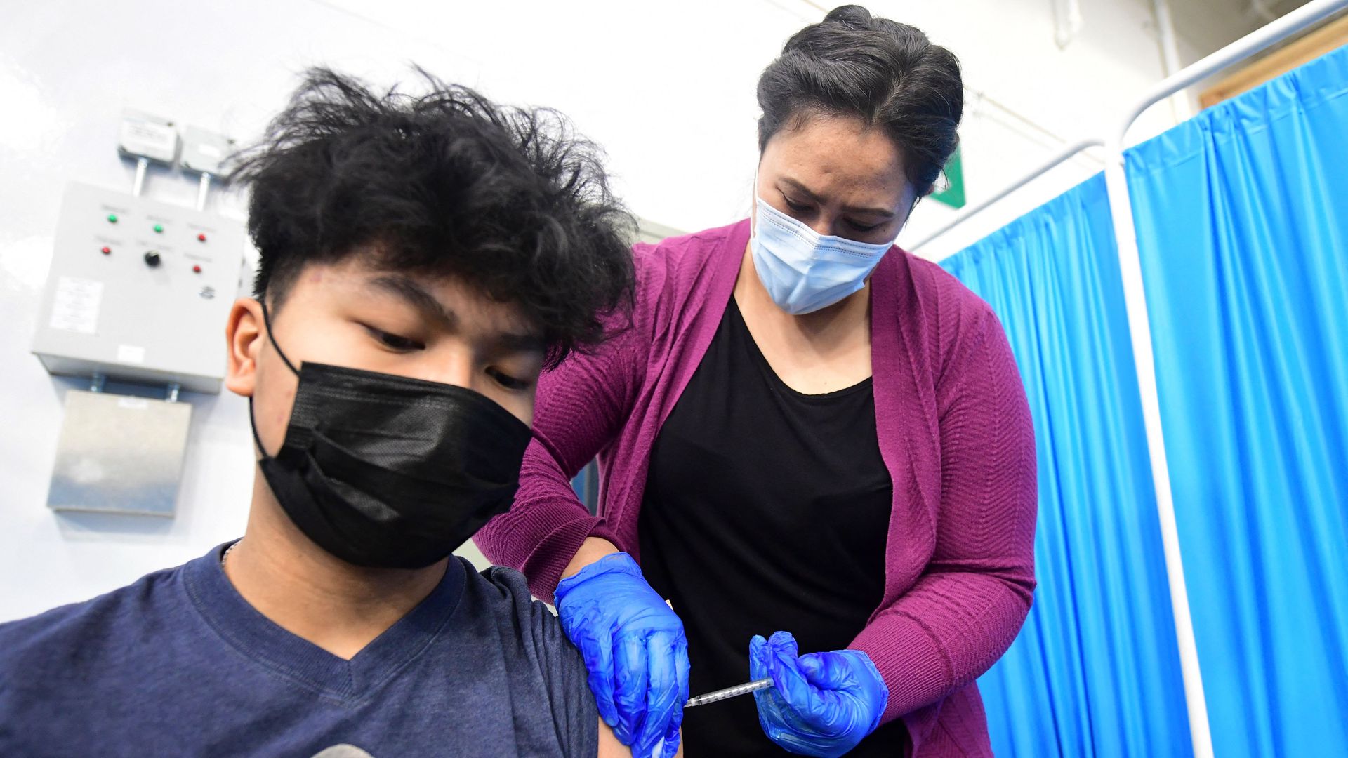 A medical assistant administering a coronavirus vaccine at a blood bank in Anchorage, Alaska, on March 19.