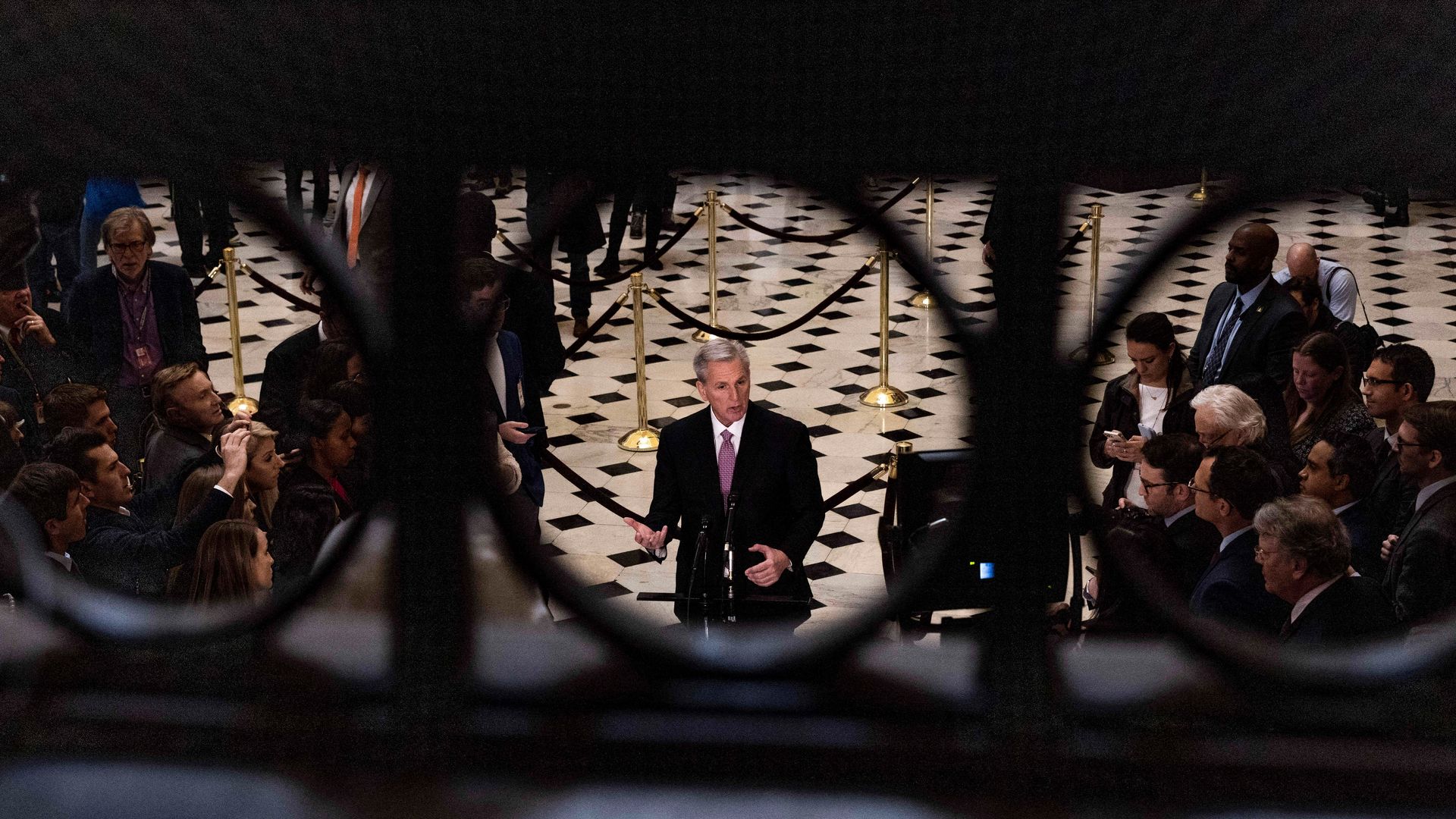 House Speaker Kevin McCarthy speaks to reporters in statuary hall.