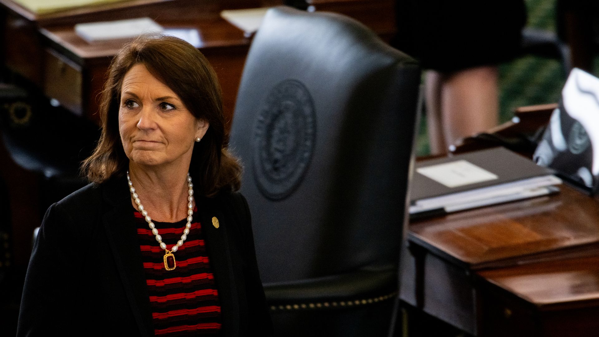 Photo of  Angela Paxton walks through the Senate floor