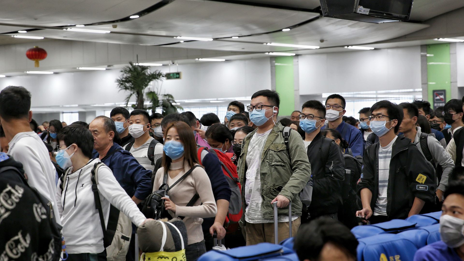 People in Shenzhen, China, waiting at a rail station