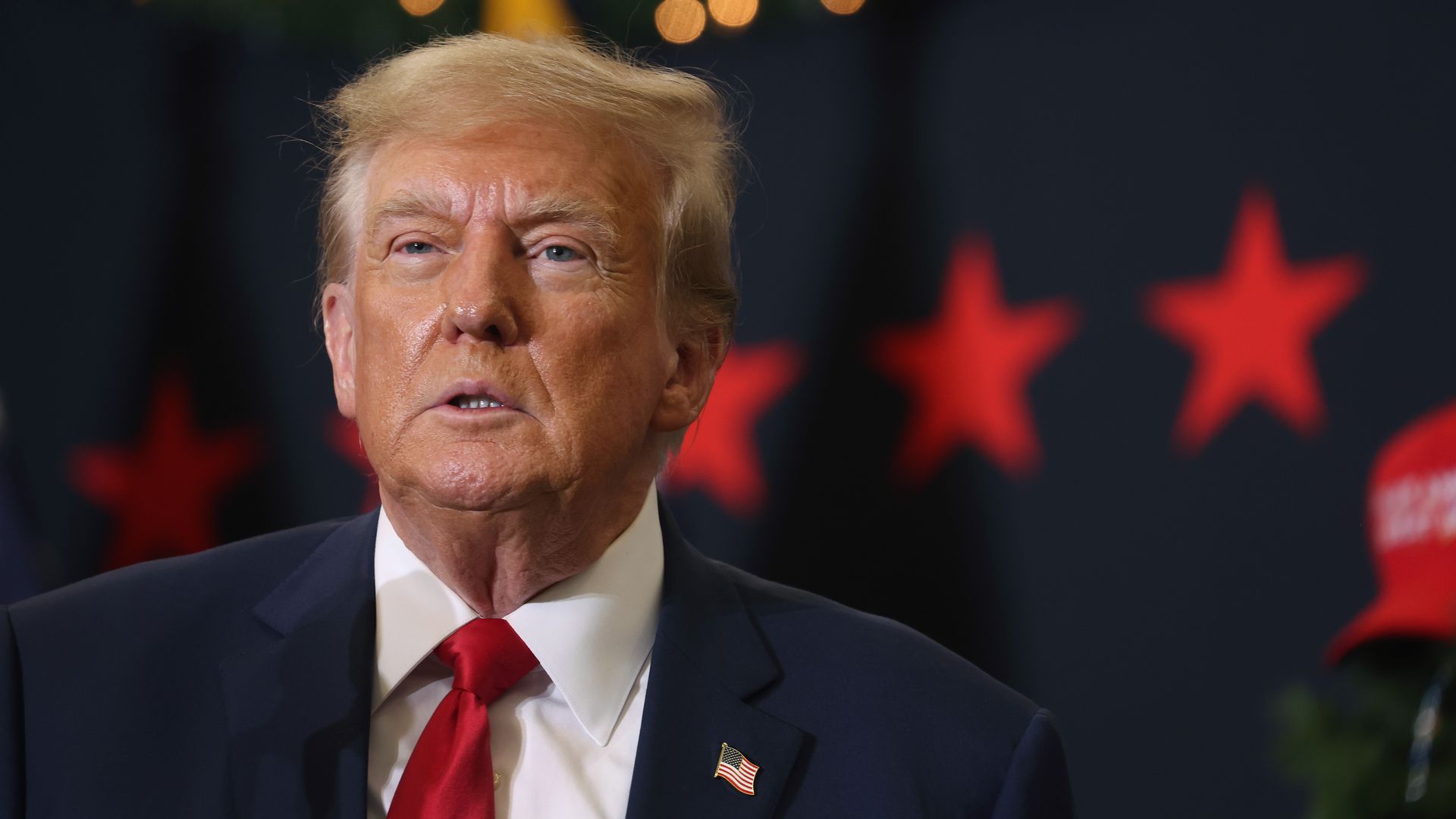 Republican presidential candidate and former U.S. President Donald Trump looks on during a campaign event on December 19, 2023 in Waterloo, Iowa