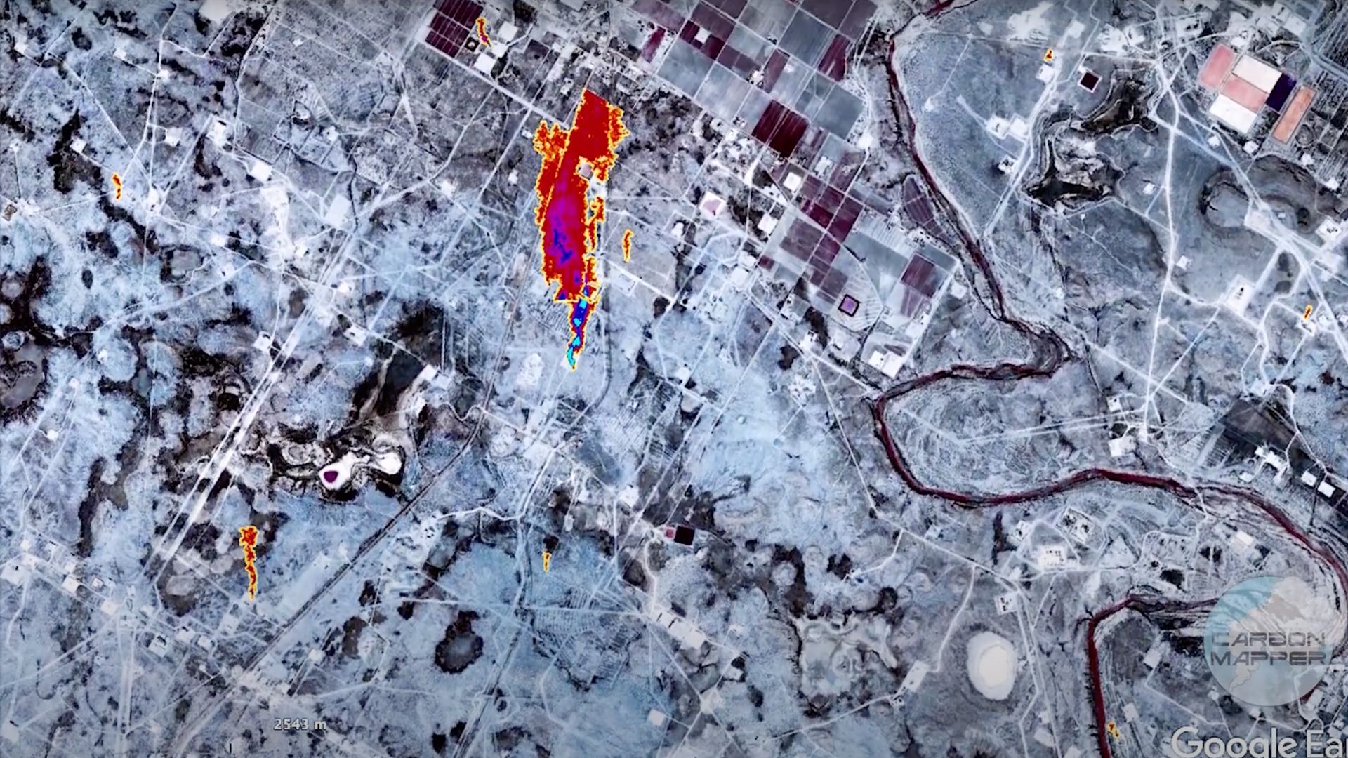 Infrared satellite image of the ground with red areas showing high emissions of methane.