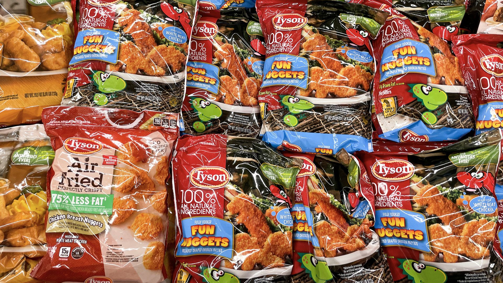 Rows of frozen Tyson chicken in a grocery store freezer