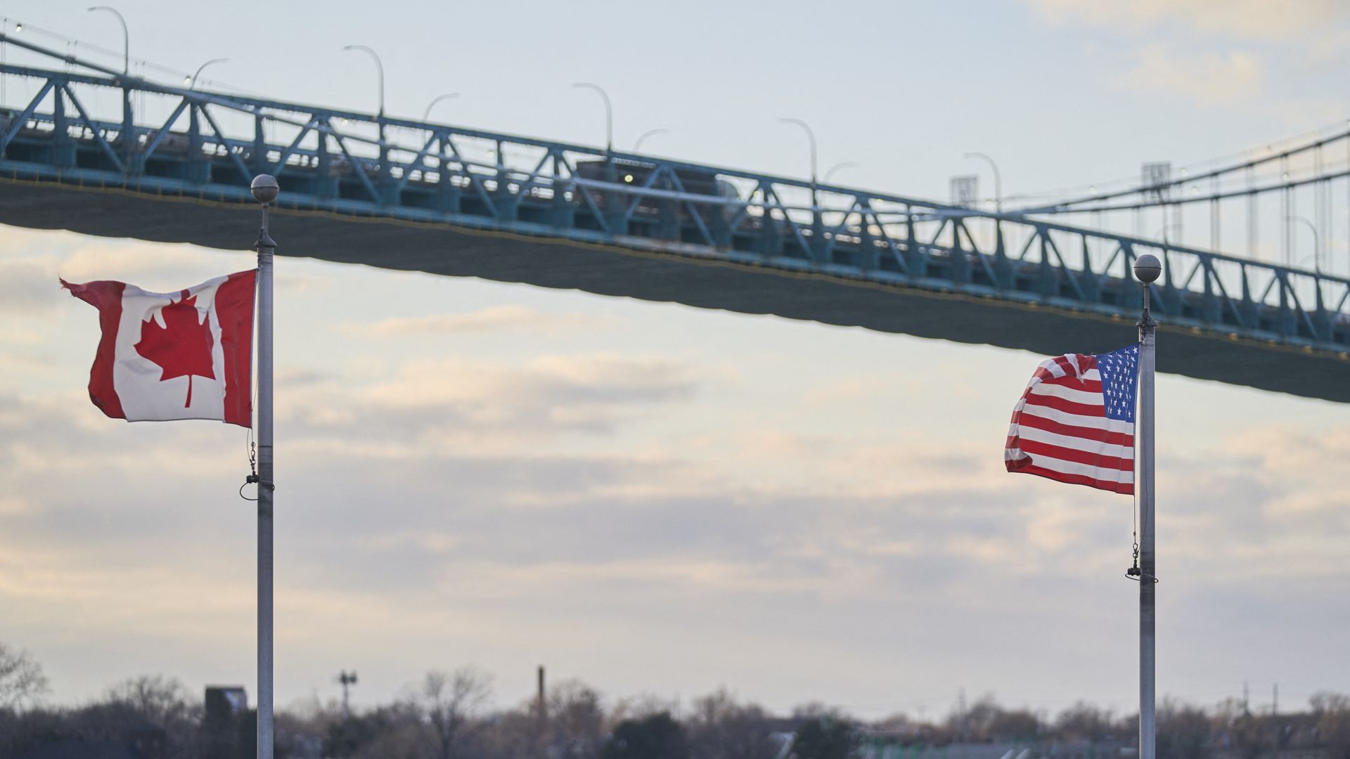 A   truck crosses the Ambassador Bridge, border crossing between Windsor, Ontario, Canada, and Detroit, Michigan, above the Canadian Vietnam Veterans Memorial on March 1, 2025. 