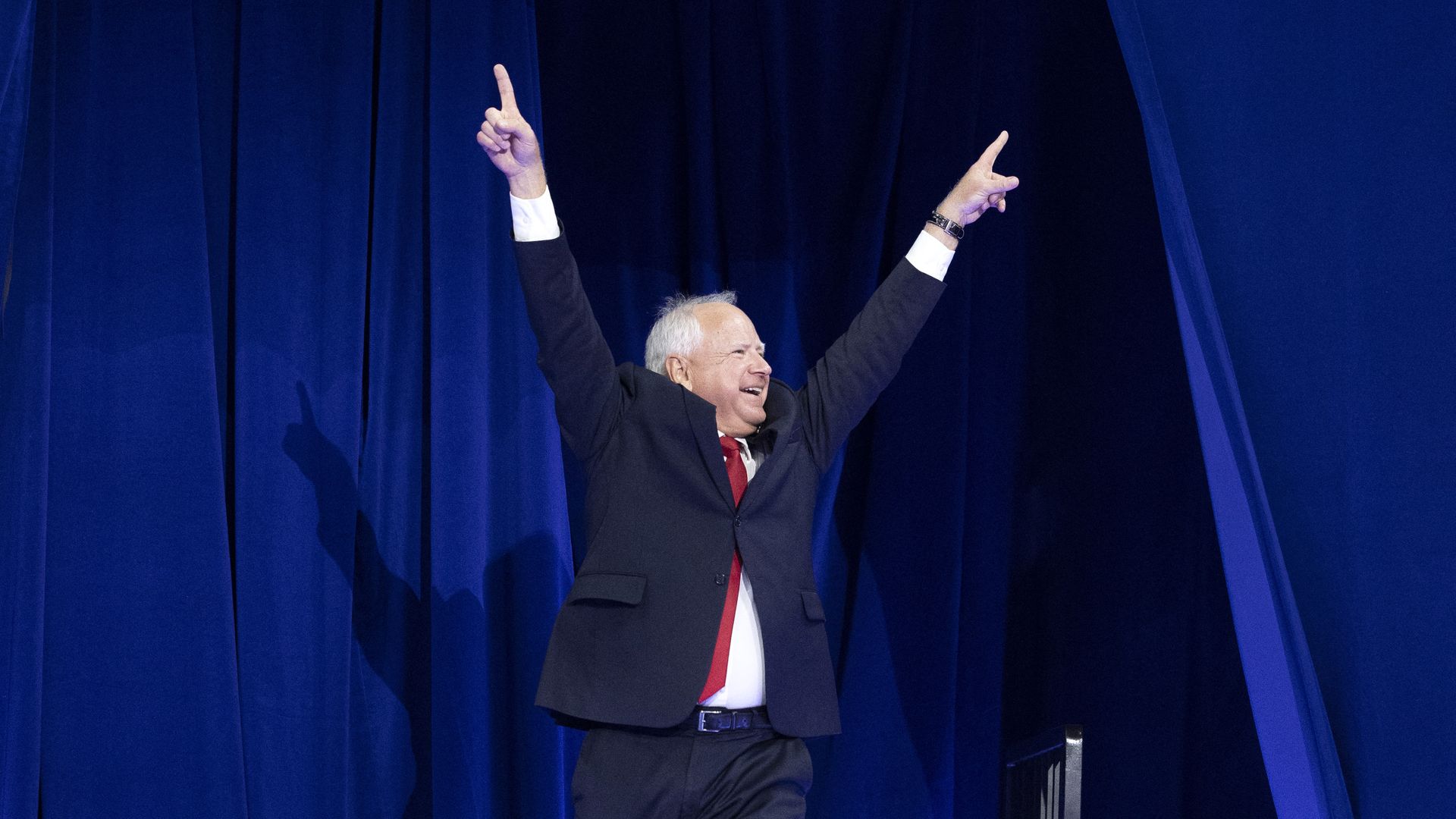 Minnesota Governor and Democratic vice presidential candidate Tim Walz arrives on stage during a campaign rally at the Thomas and Mack Center, University of Nevada in Las Vegas, Nevada, on August 10, 2024. (Photo by RONDA CHURCHILL / AFP) (Photo by RONDA CHURCHILL/AFP via Getty Images)