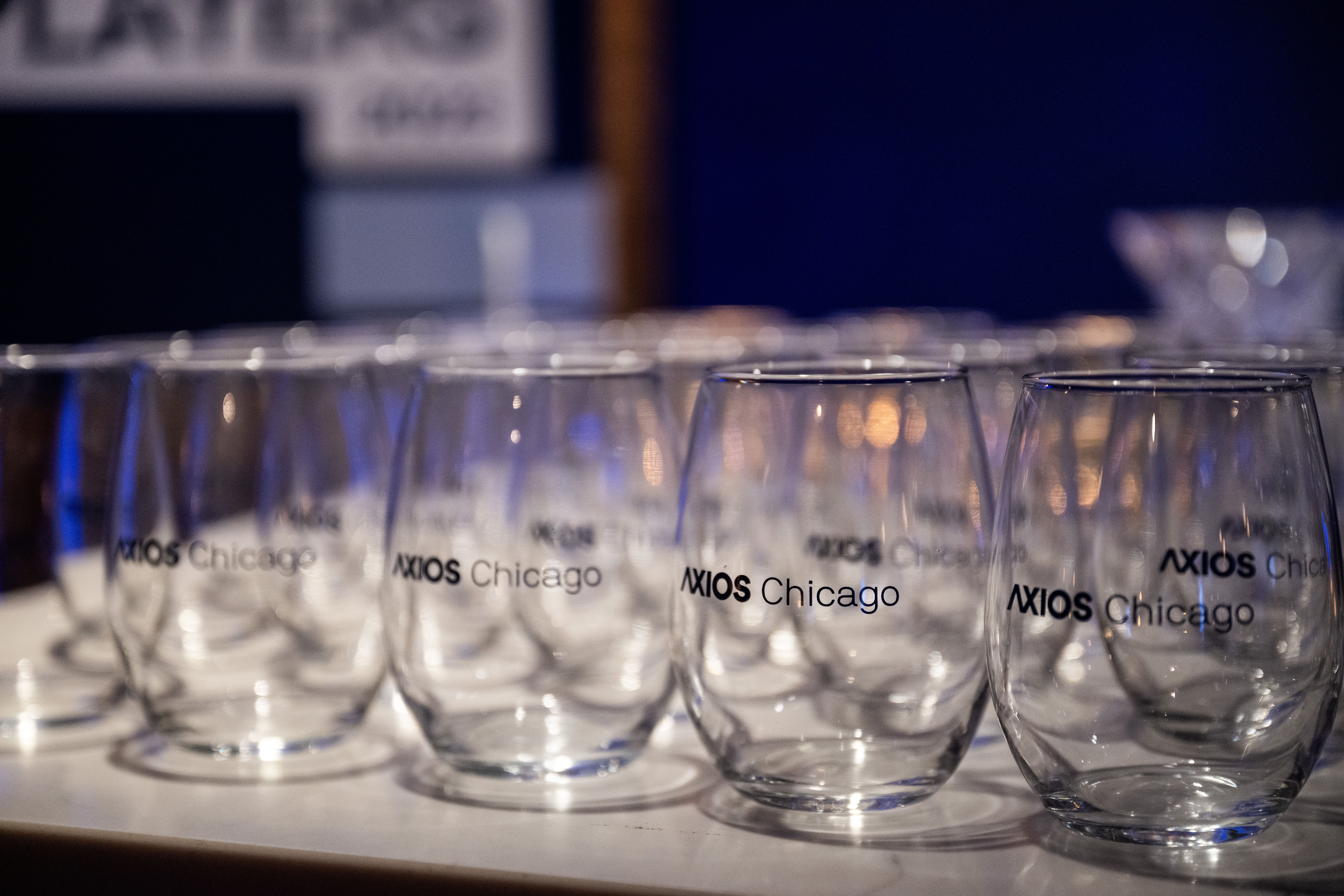 collection of stemless wine glasses with the words Axios Chicago on them