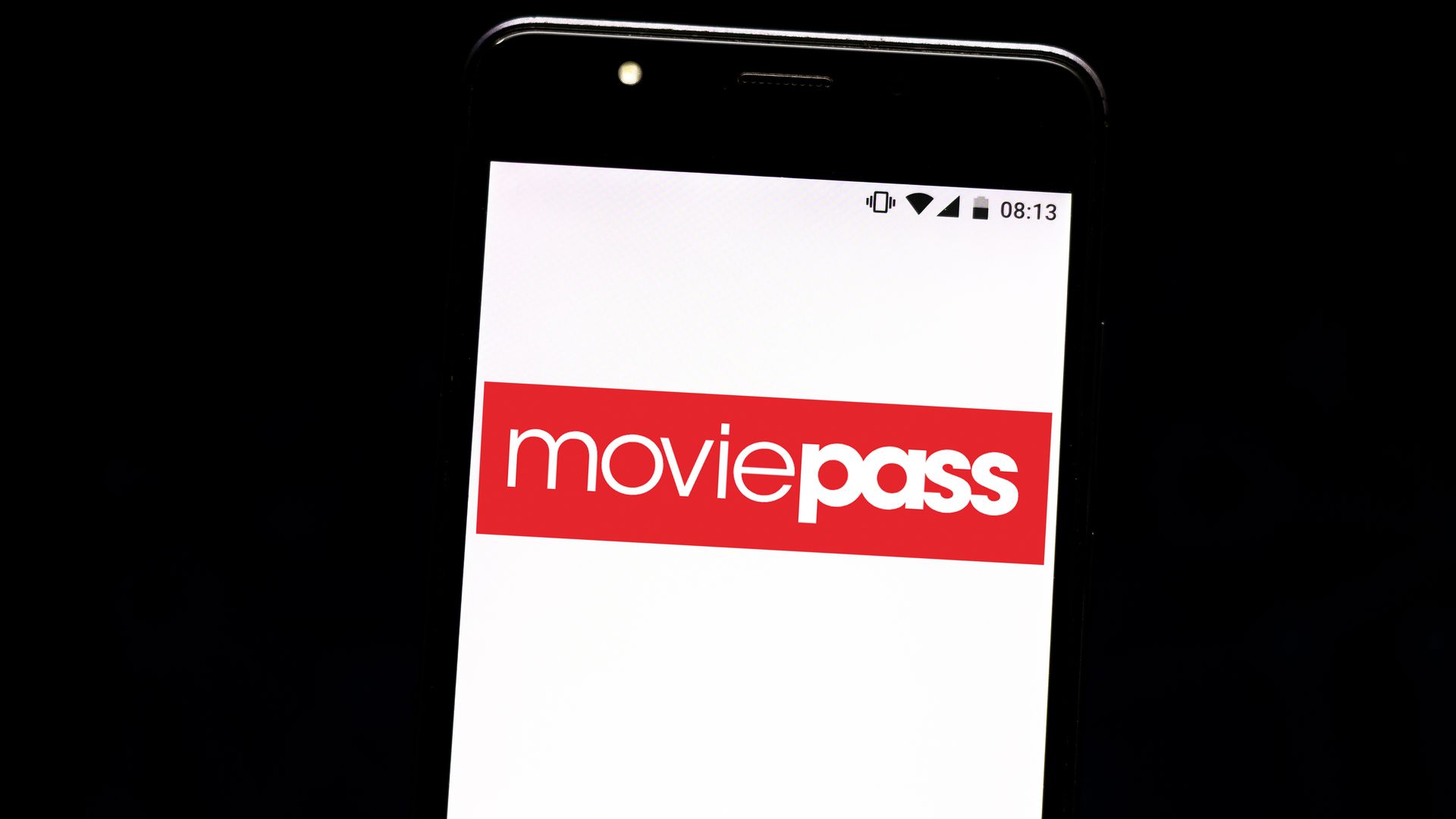 This image shows a phone with the Moviepass logo on it.